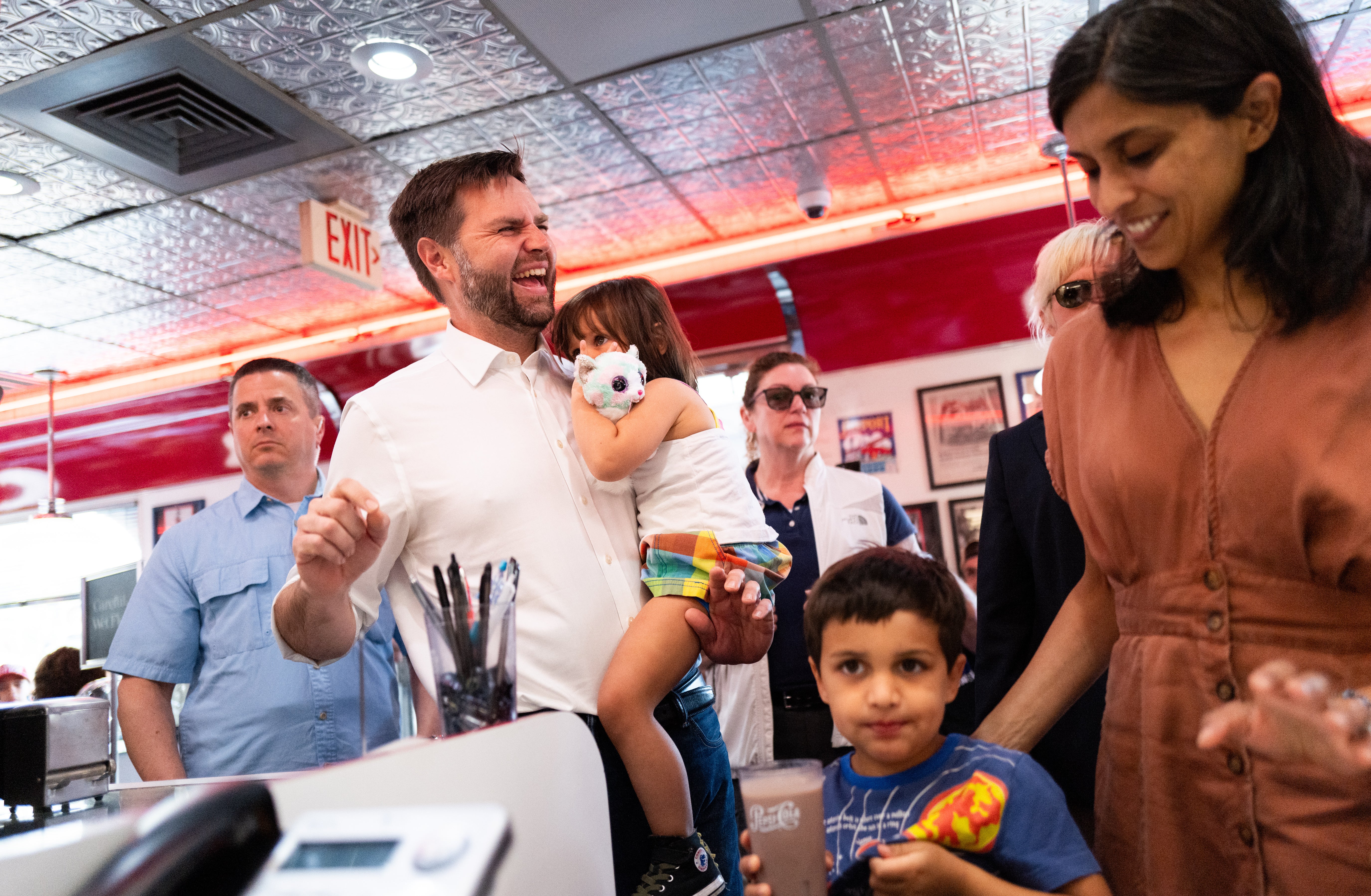 JD Vance pictured with wife Usha, his daughter Mirabel and his son Vivek at a campaign stop in Minnesota on July 28