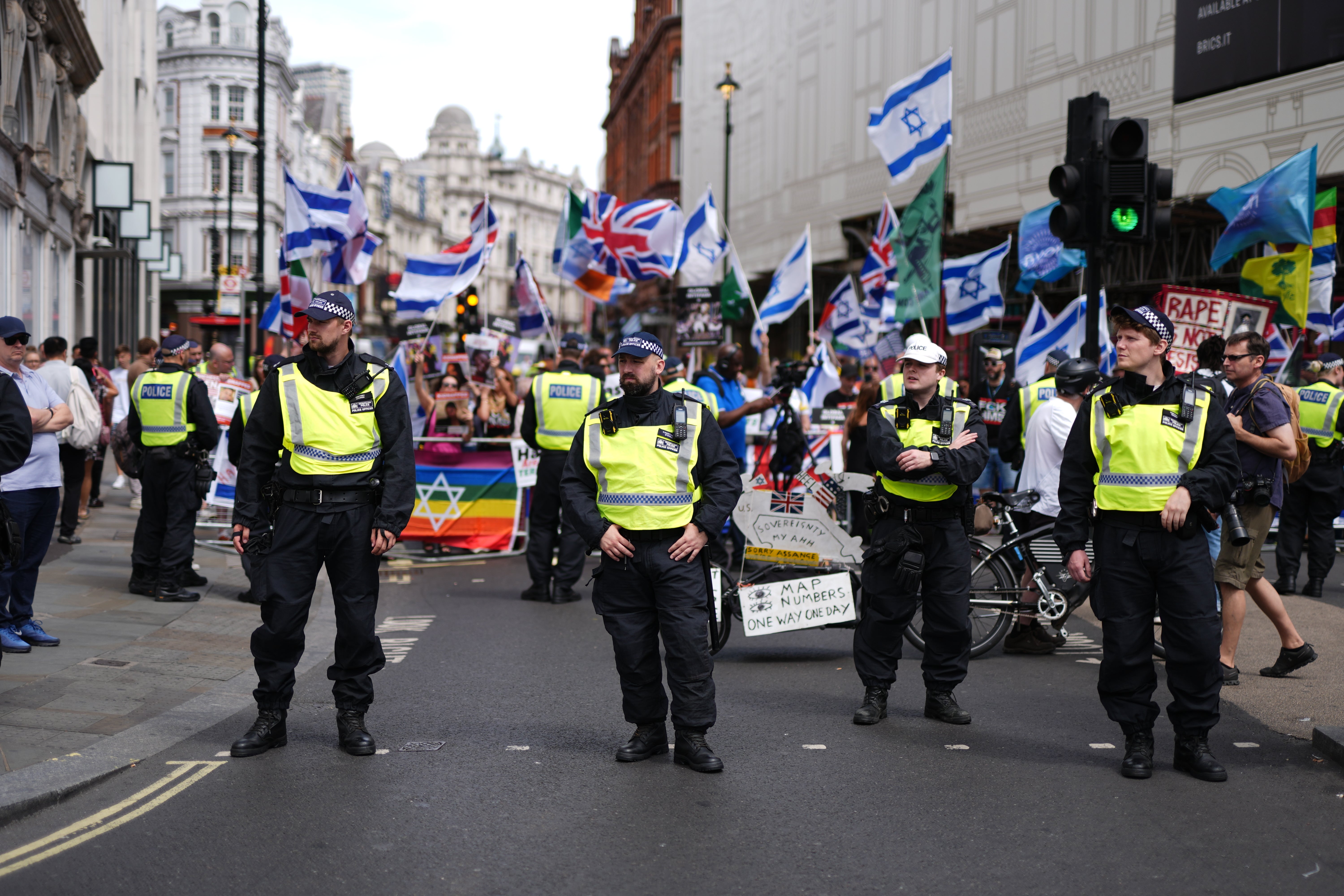 A heavy police presence as people take part in the Enough is Enough protest in London’s Piccadilly Circus