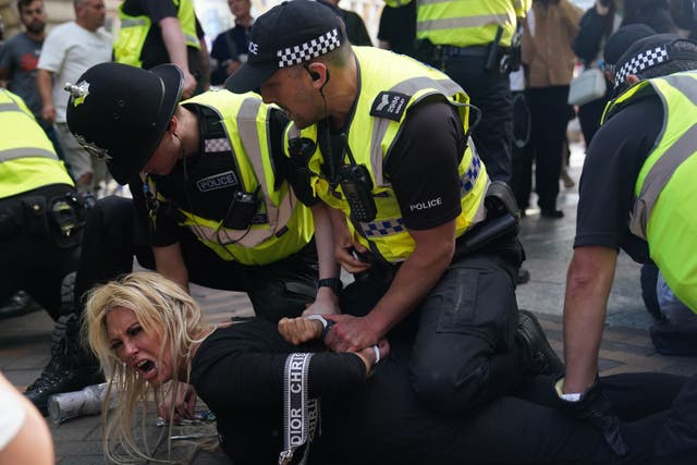 Police detain a woman during a protest in Nottingham (Jacob King/PA)