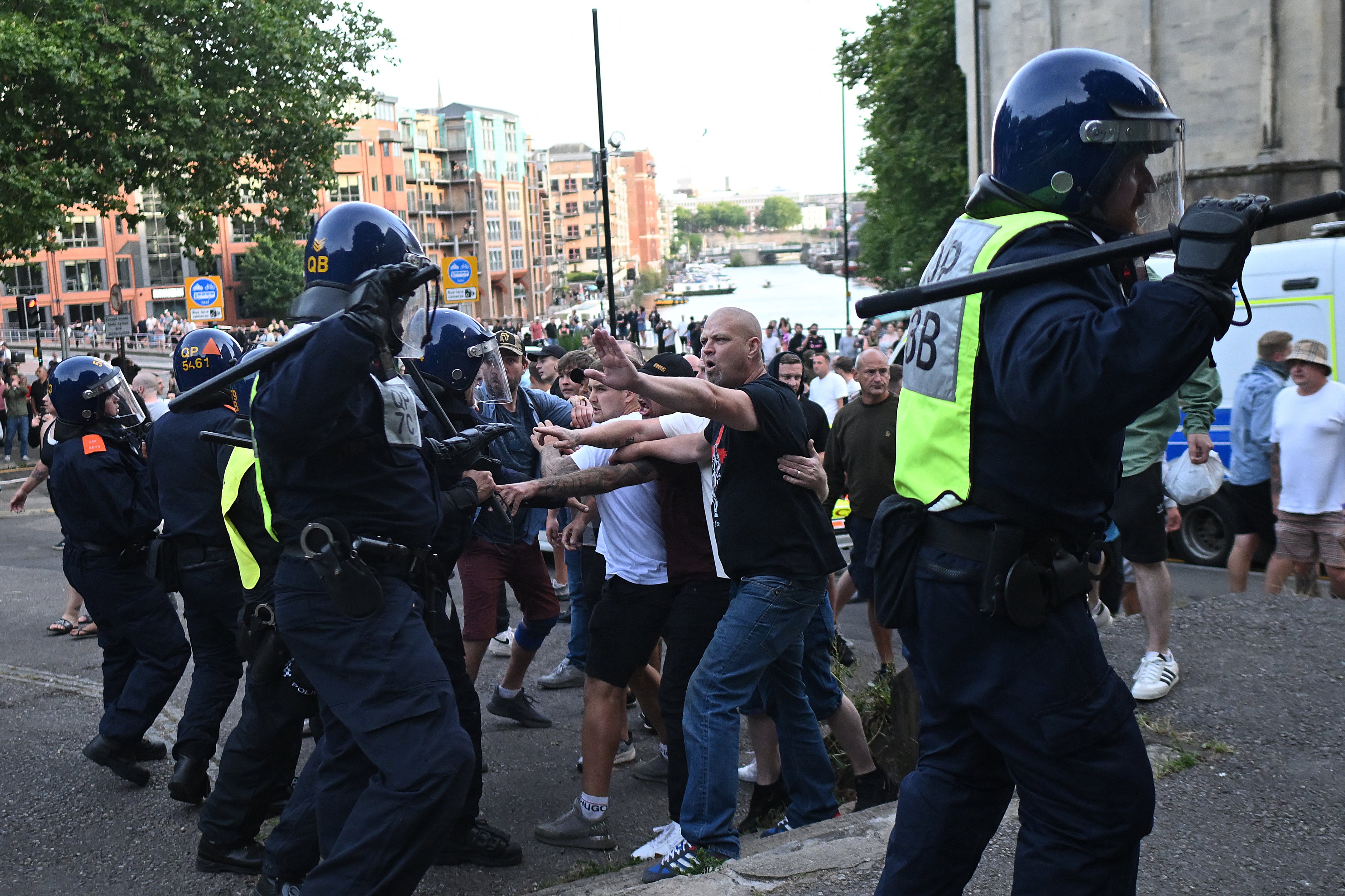 Police officers face off with protesters during the 'Enough is Enough' demonstration called by far-right activists in Bristol