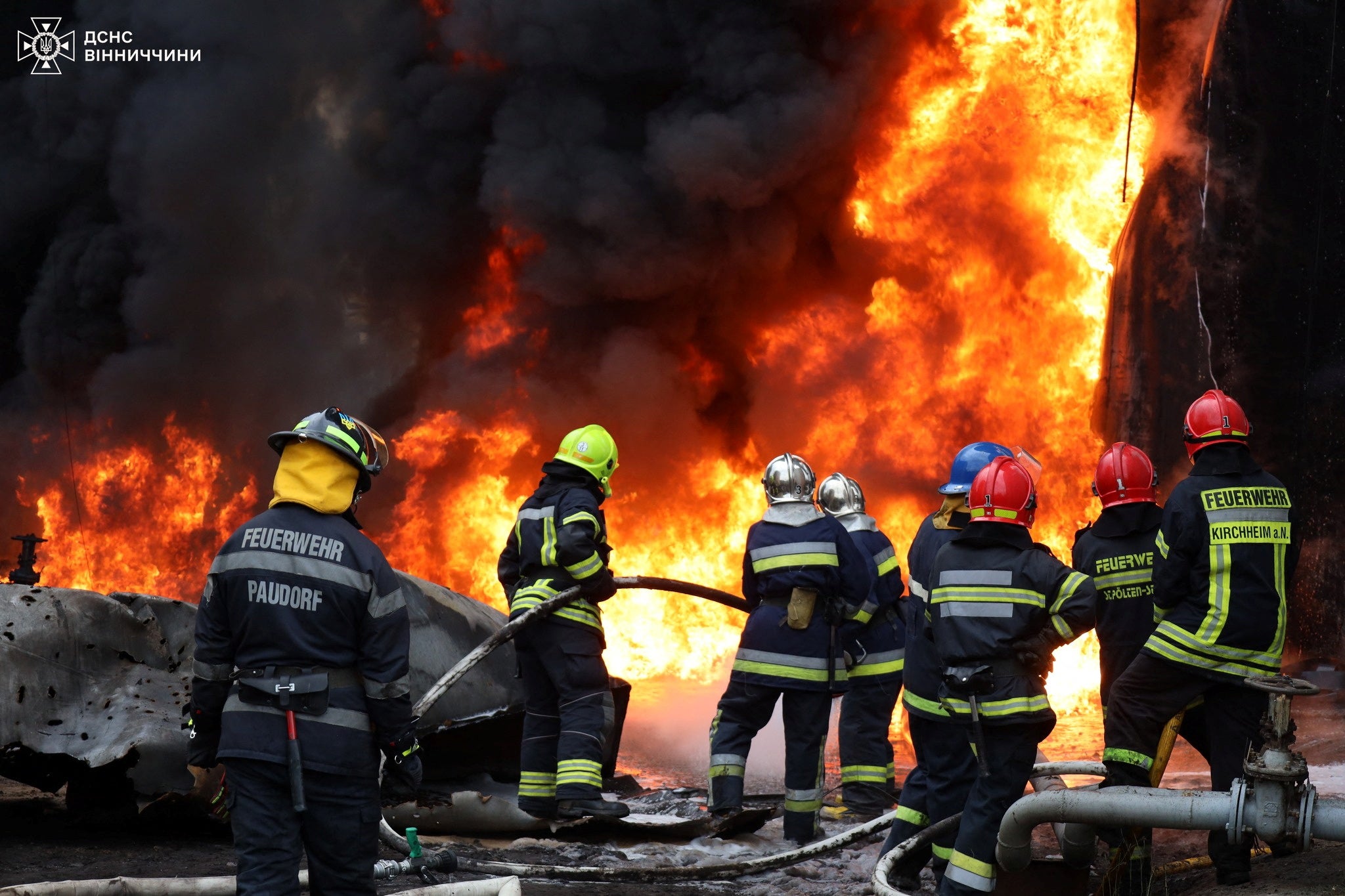 Firefighters work at the site where a critical infrastructure facility was damaged during a Russian drone strike