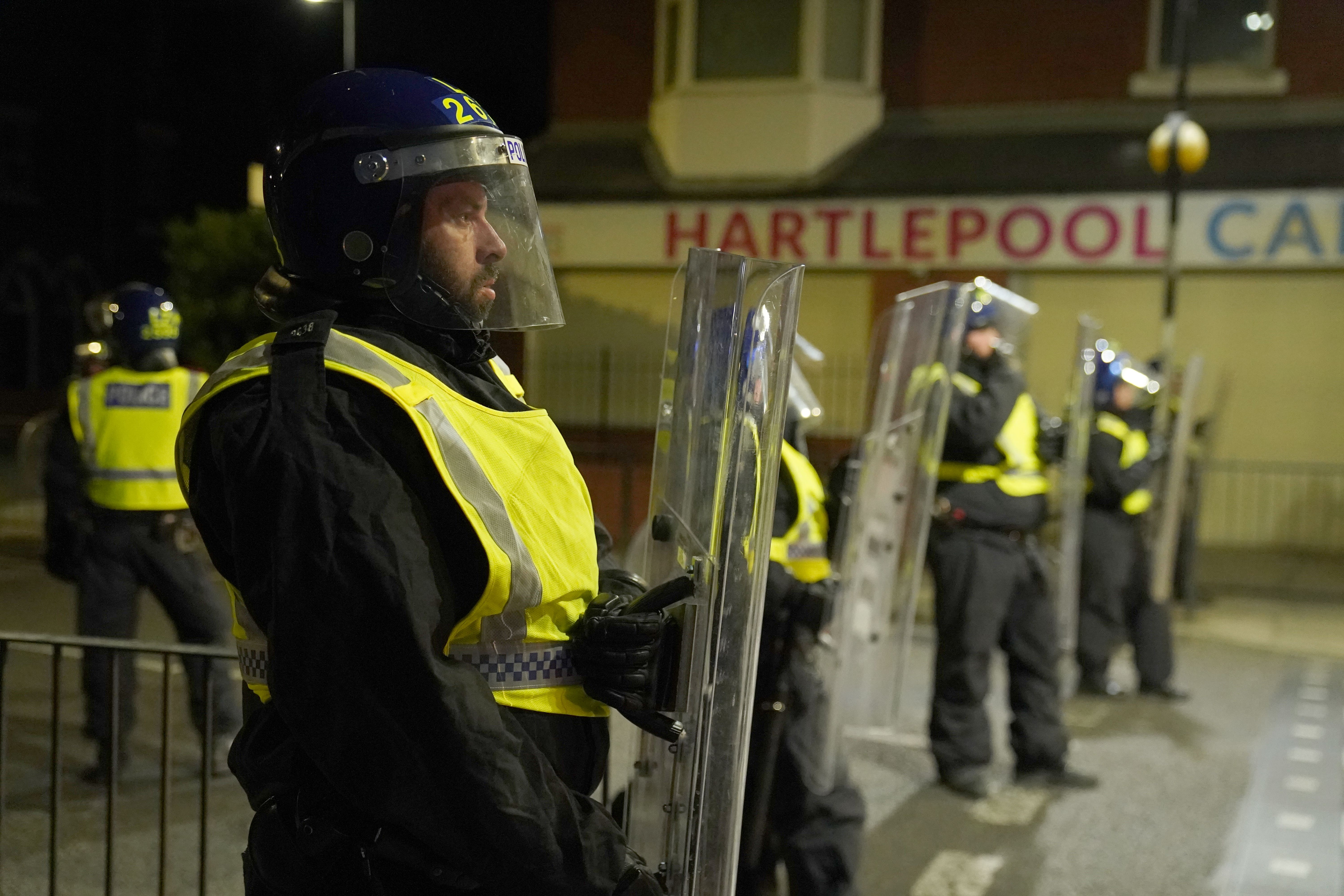 Police officers on the streets of Hartlepool following a violent protest (PA)