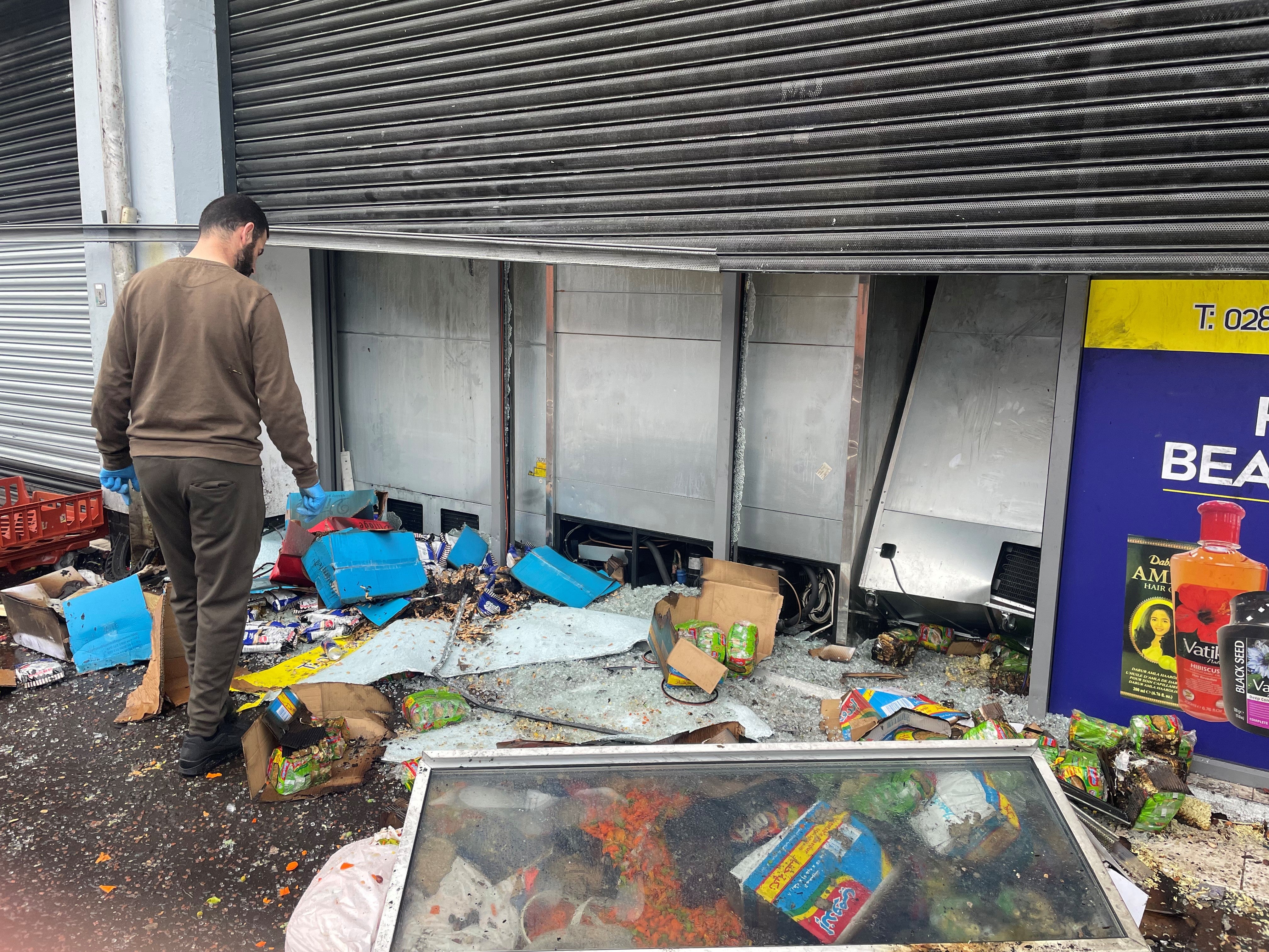 A Syrian supermarket in Belfast was destroyed by a fire after violent riots in the city on Saturday