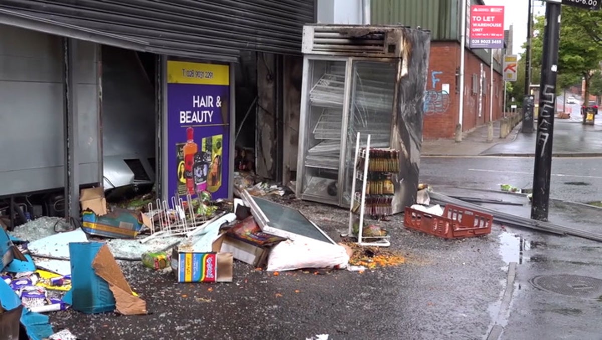 Heartbroken supermarket manager clears burnt-out store after violence in Belfast