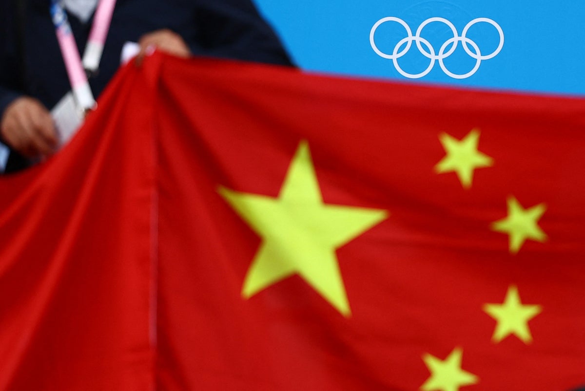 Coach convicted of sexual abuse departs Olympics after being spotted on TV among China’s team