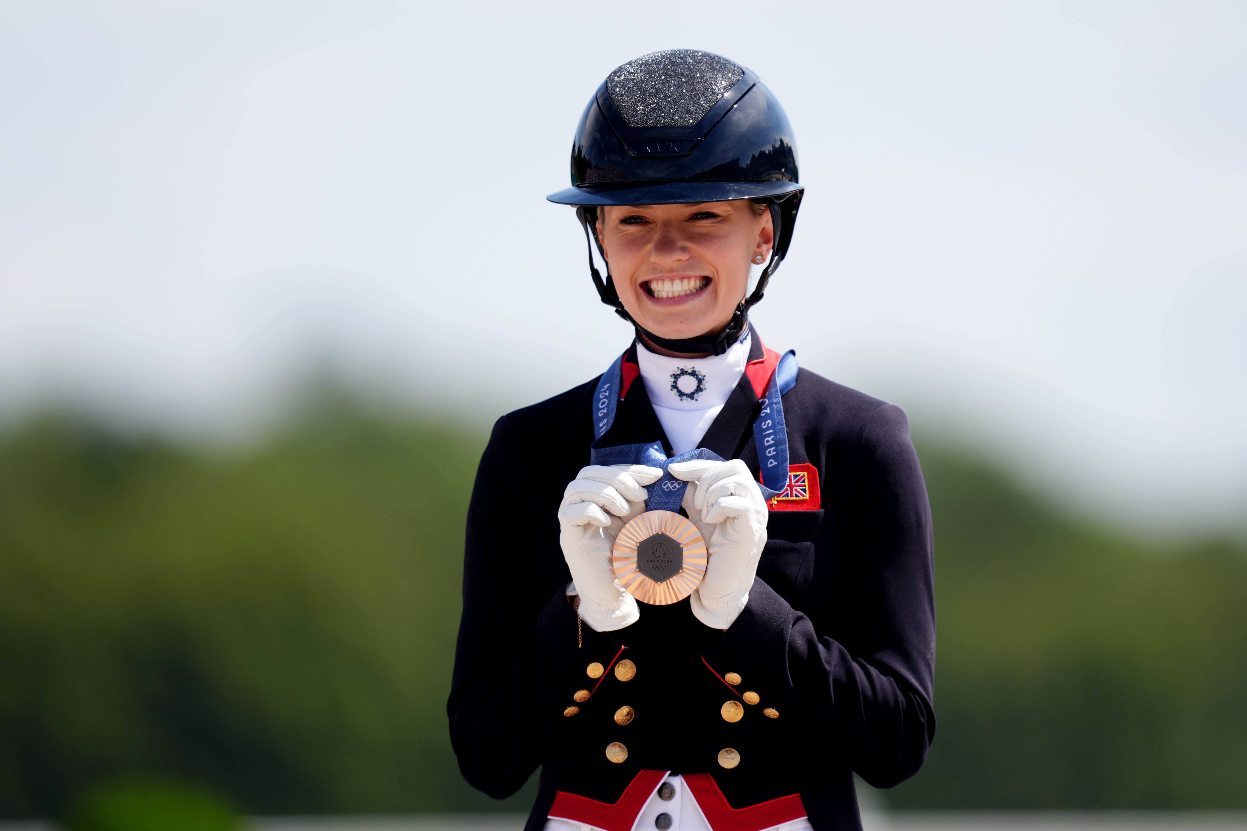 Charlotte Fry with her bronze medal following the individual dressage competition (John Walton/PA)