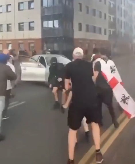 Footage of the incident saw men approach the vehicle, with one wearing an England flag