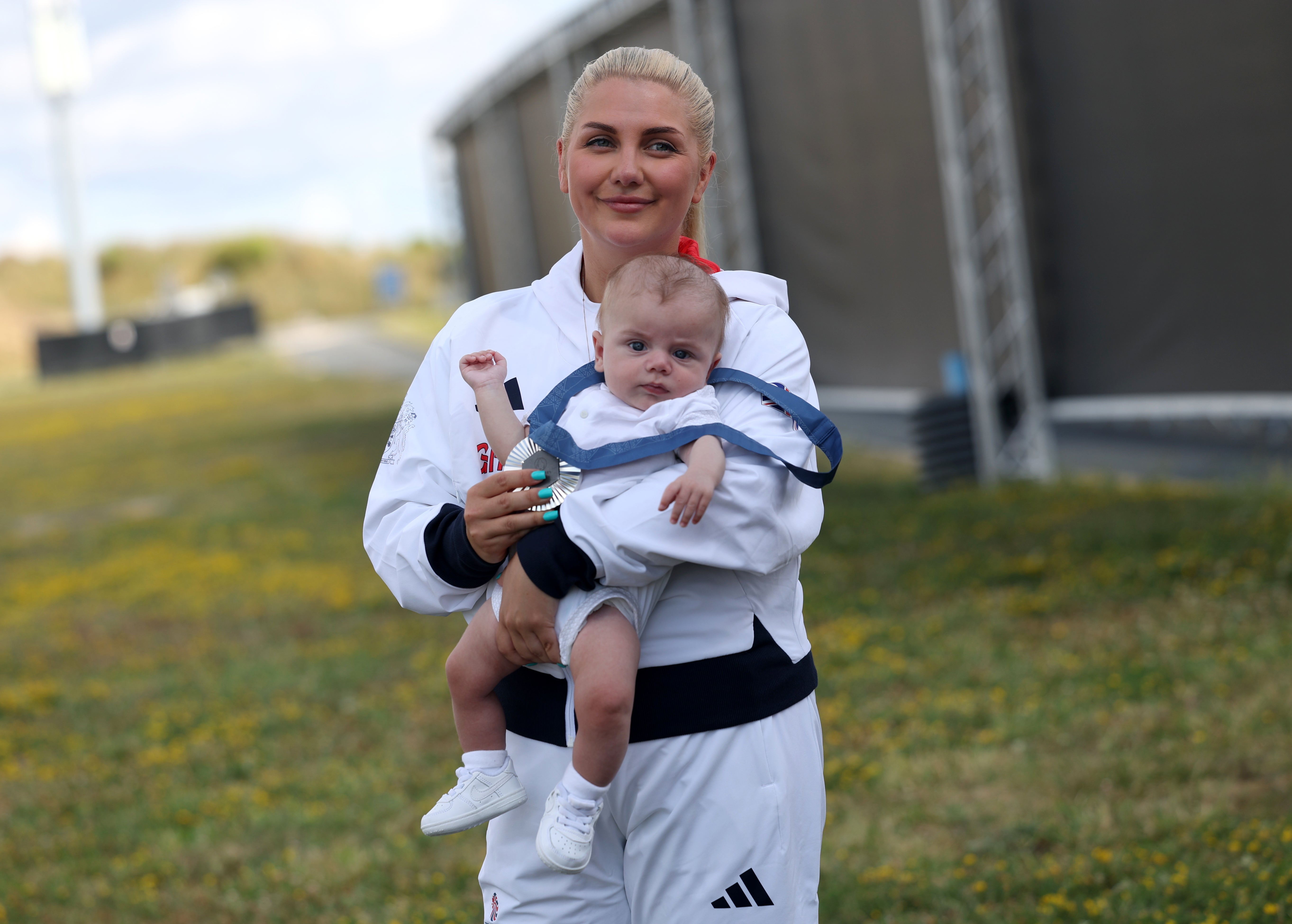 Amber Hill was welcomed by her son Tommy moments after winning a silver medal (Isabel Infantes/PA)