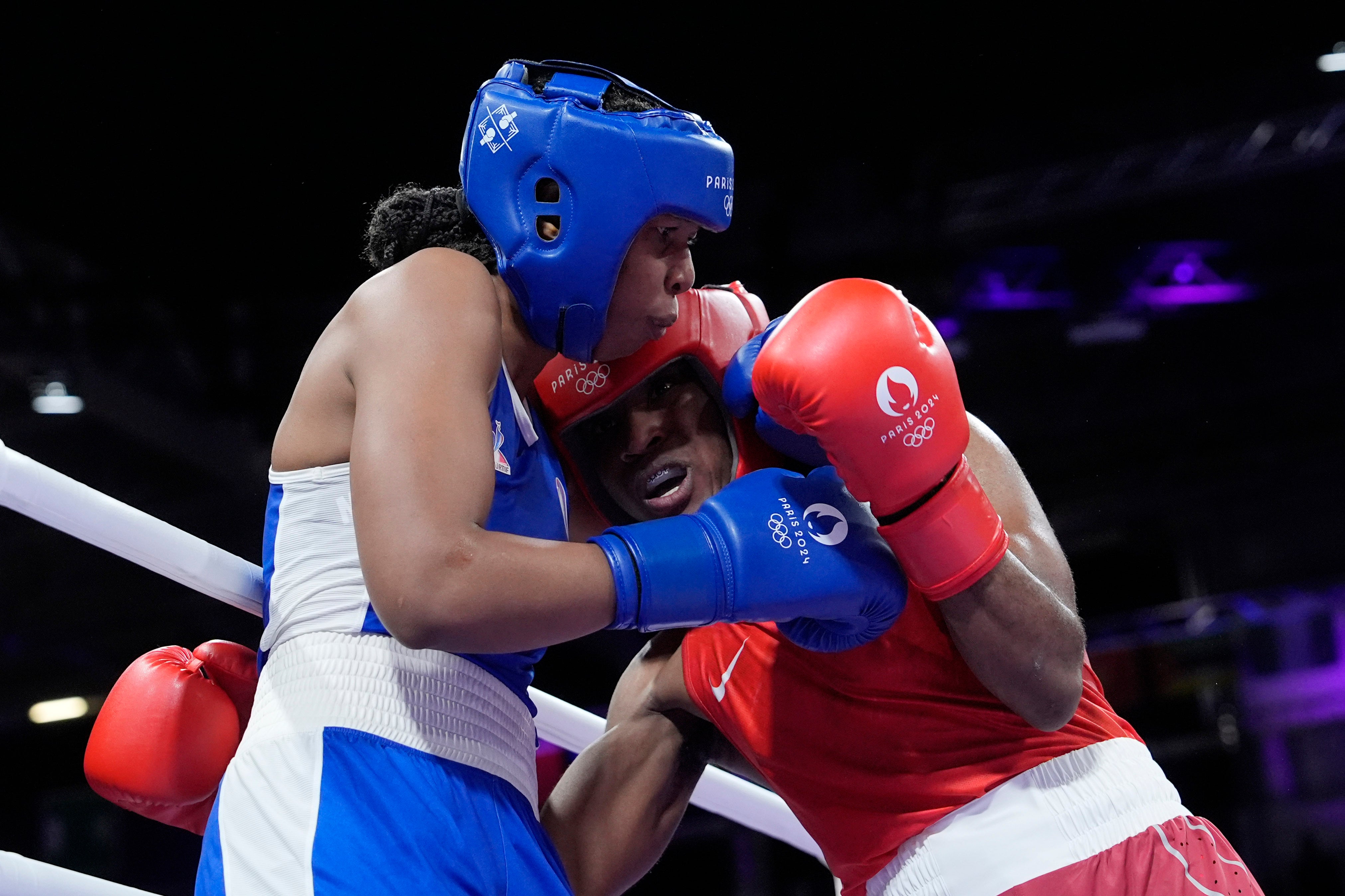 Refugee Olympic Team's Cindy Ngamba, right, fights France's Davina Michel