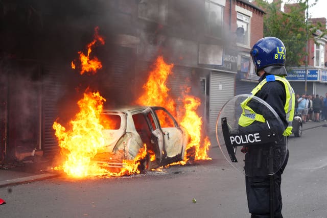 <p>A car burns on Parliament Road, in Middlesbrough, during an anti-immigration riots (Owen Humphreys/PA)</p>