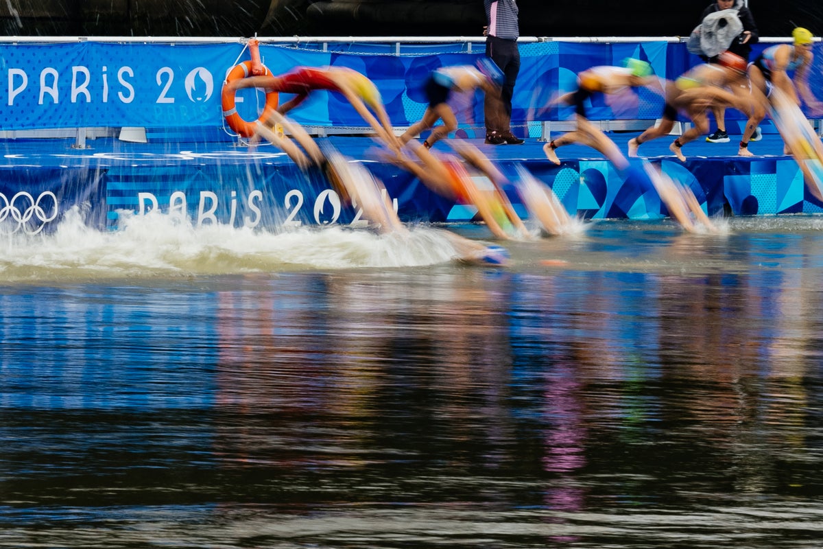 Belgium withdraw from triathlon relay as athlete falls ill after swimming in Seine