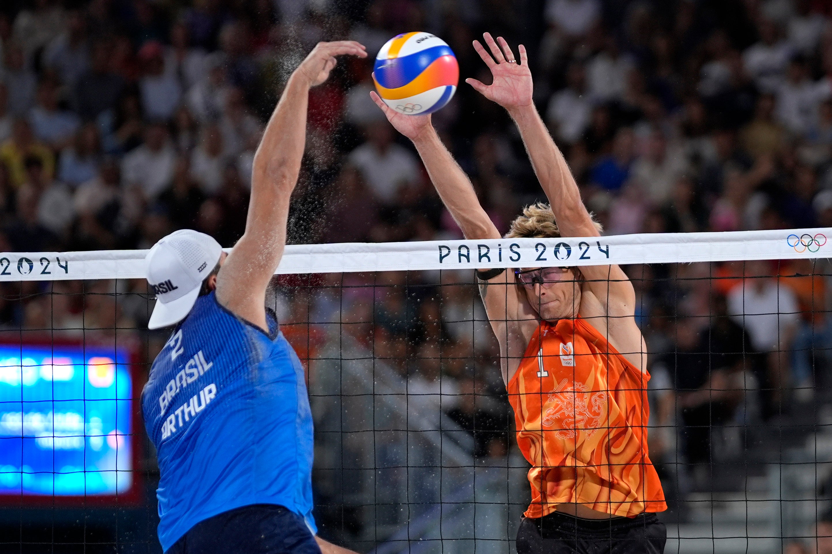 Brazil’s Arthur Diego Mariano Lanci hits by Netherland’s Steven van de Velde in a beach volleyball match