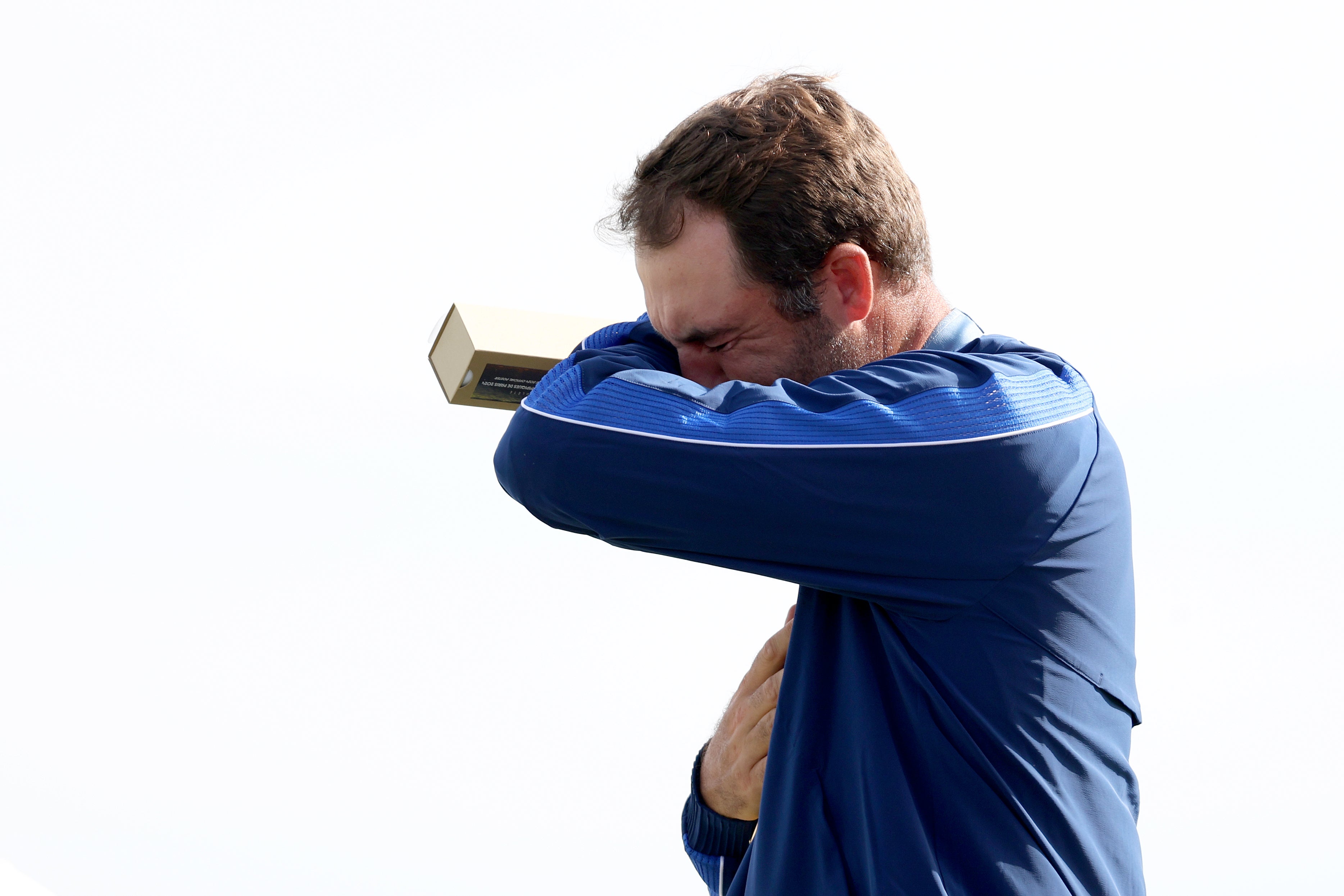 Scottie Scheffler, pictured, began to cry as he accepted the gold medal for Team USA after winning the men’s individual golf competition on Sunday