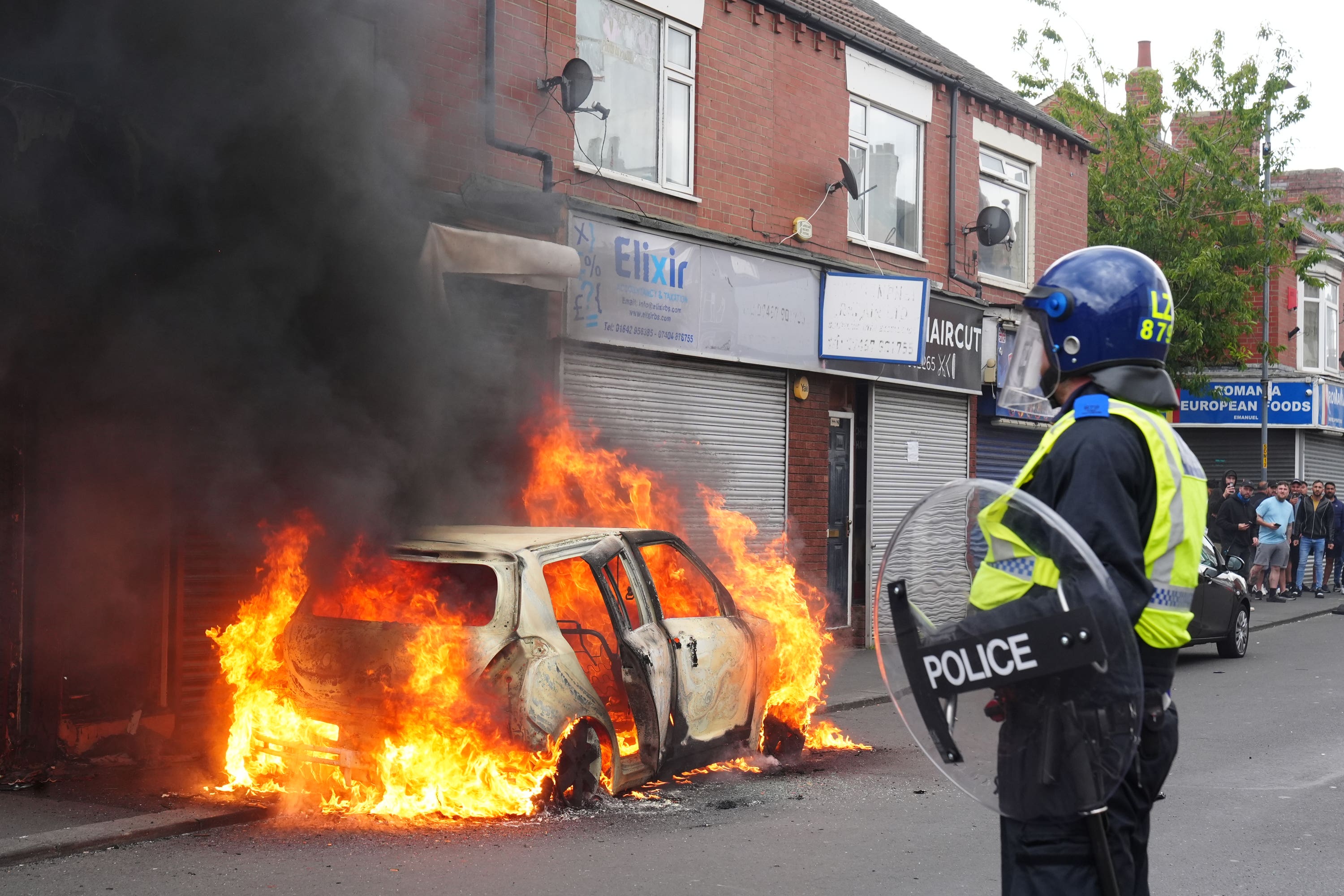 A car burns in Middlesbrough, during a racist anti-immigration riot