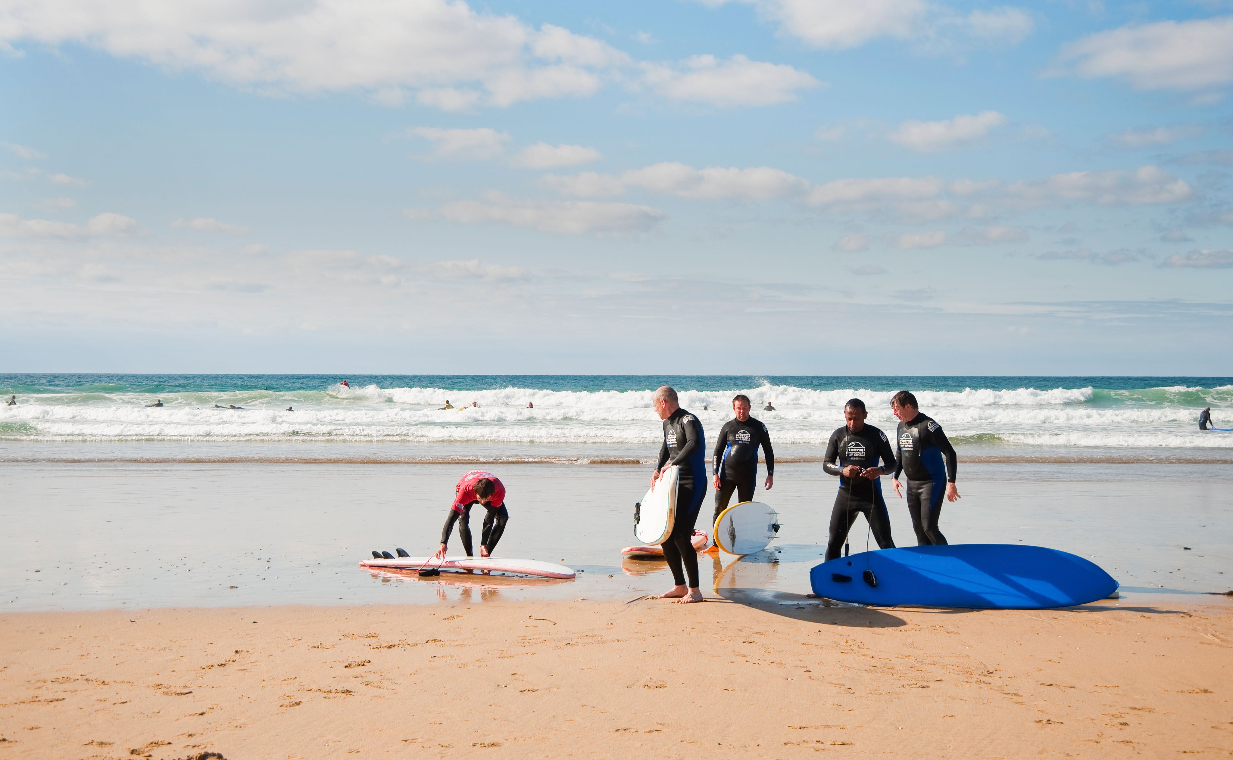 Surfers in Newquay, Fistral Beach, Cornwall