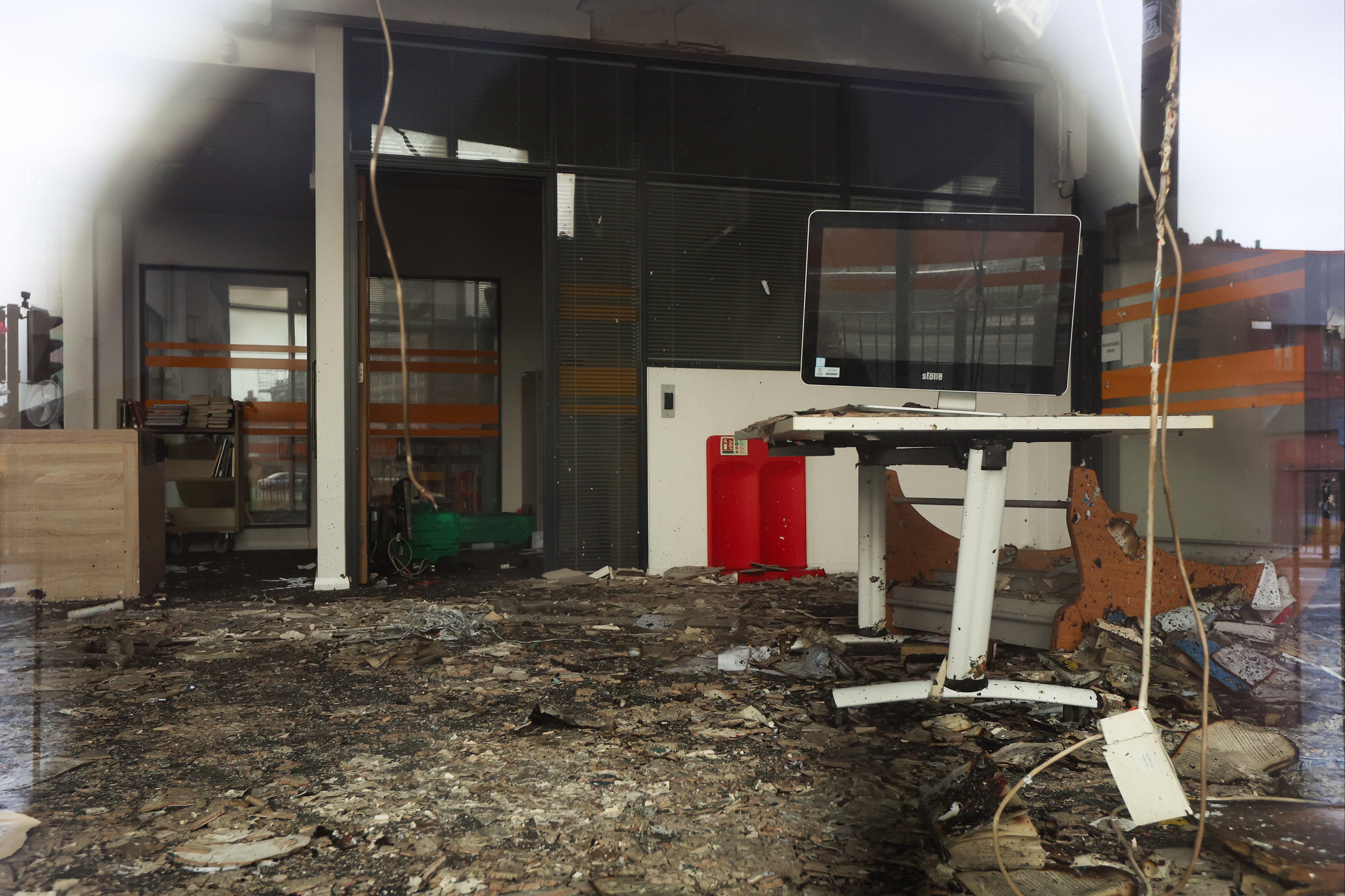 The destroyed interior of the Spellow Hub community library after a night of violent disorder in Liverpool