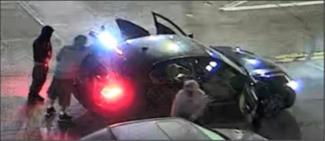 <p>LAPD released image of three suspects in a Los Angeles parking lot</p>
