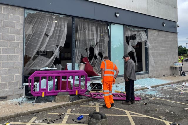 Damage at the Holiday Inn Express in Rotherham, South Yorkshire, where anti-immigration rioters smashed the windows before starting fires on Sunday (Dave Higgens/PA)