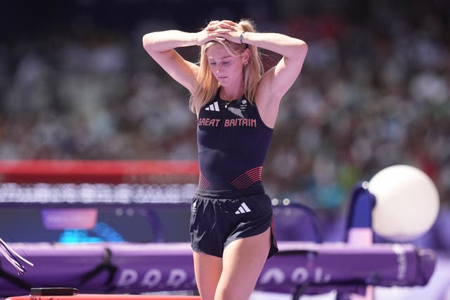 <p>Great Britain’s Molly Caudery holds her head in her hands after failing to qualify for the women’s pole vault final (Martin Rickett/PA).</p>