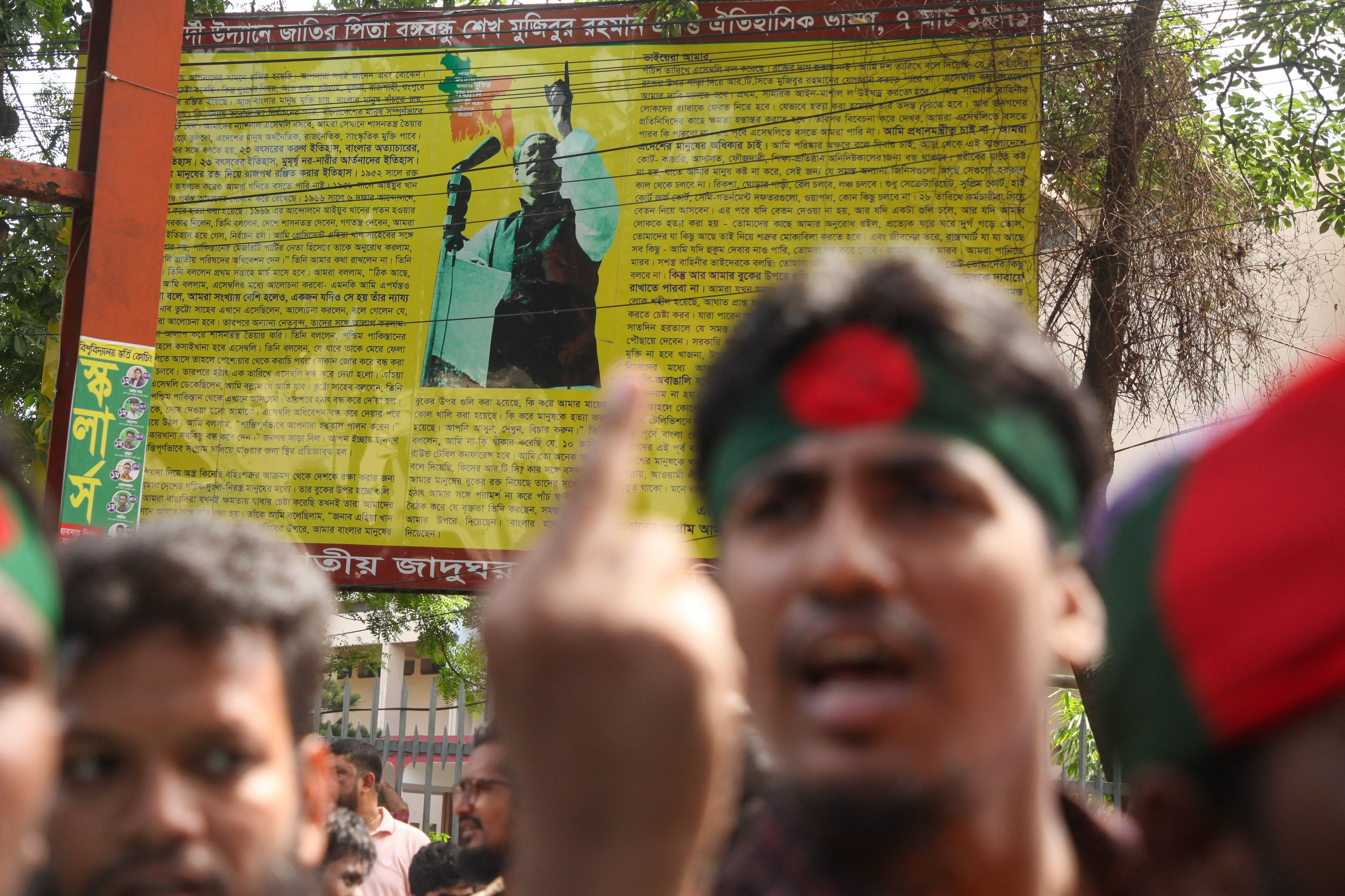 Protesters block an intersection during a protest in Dhaka