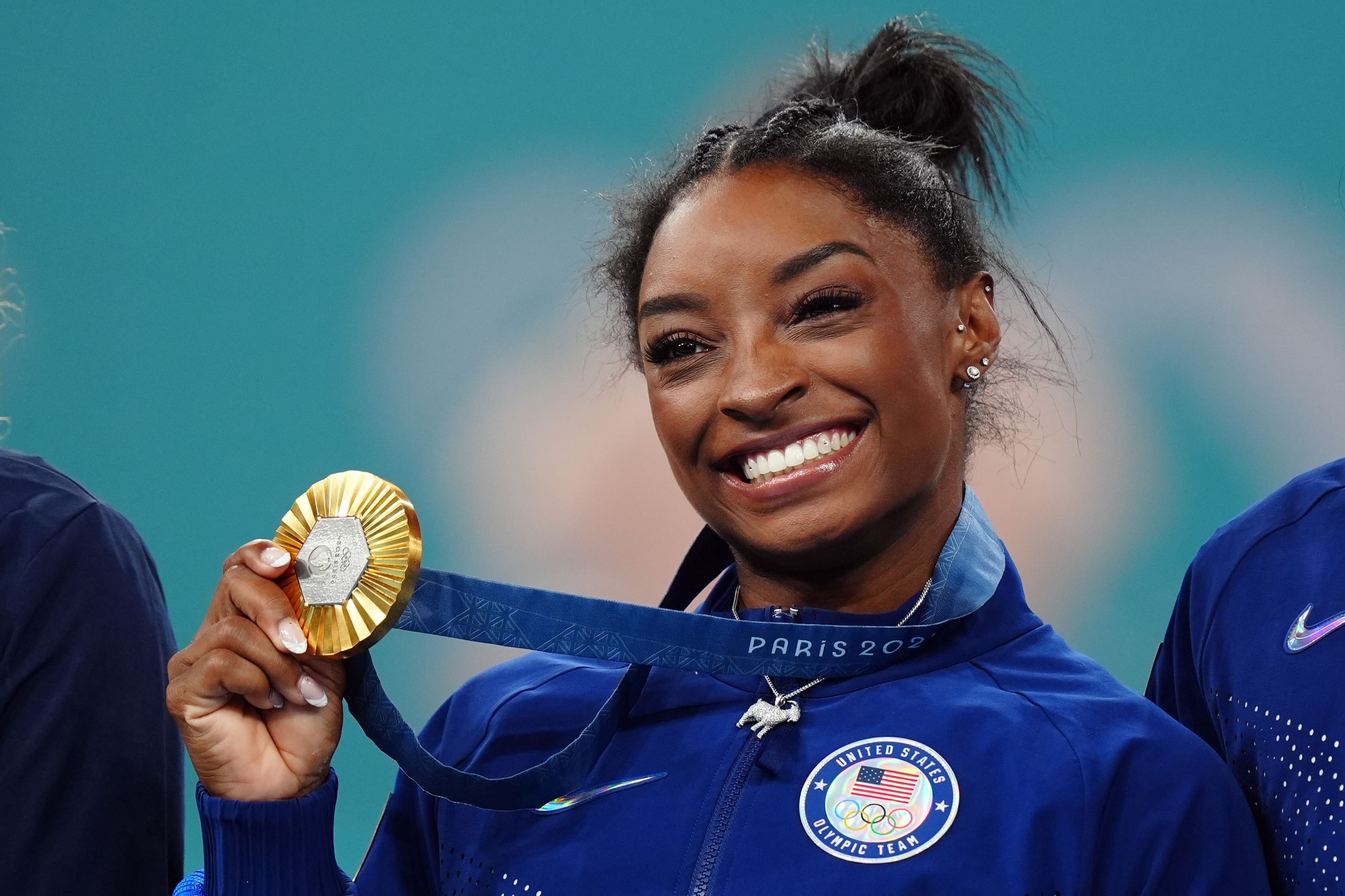 Simone Biles with her gold medal following the women’s all-around final at the Bercy Arena (Mike Egerton/ PA)