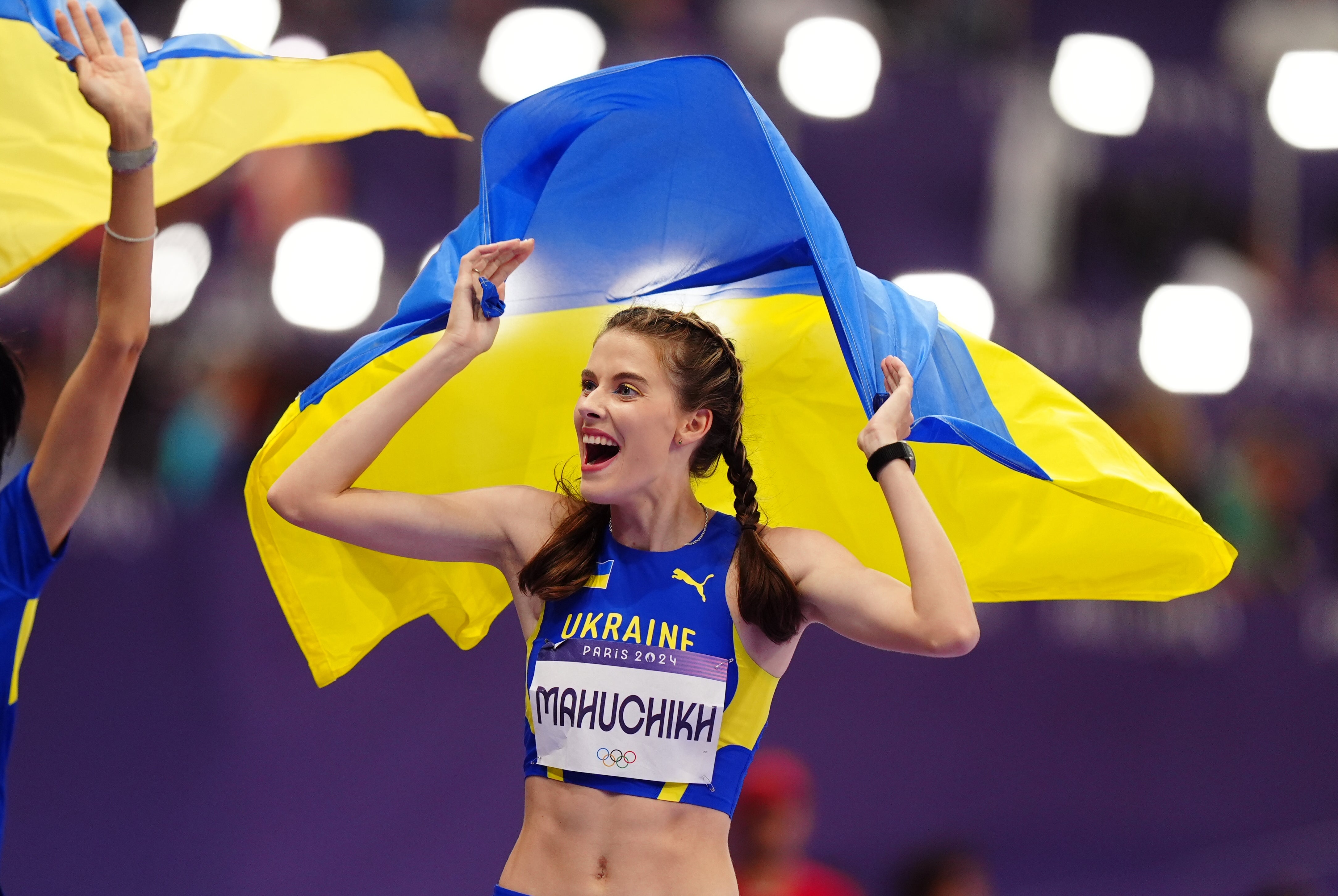 Yaroslava Mahuchikh wore blue and yellow eye-liner and a berry lip at the Olympic Games (Mike Egerton/PA)