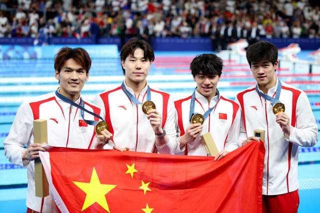 <p>Qin Haiyang, second from left, won the 4x100m medley relay on Sunday night</p>