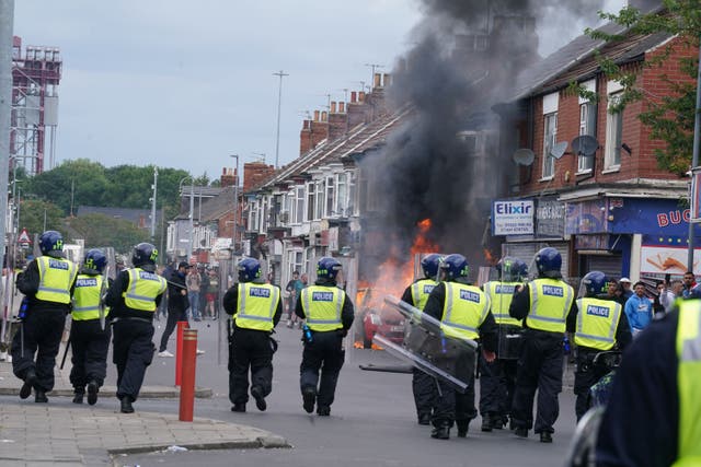 A car burns during a protest in Middlesbrough (Owen Humphreys/PA)