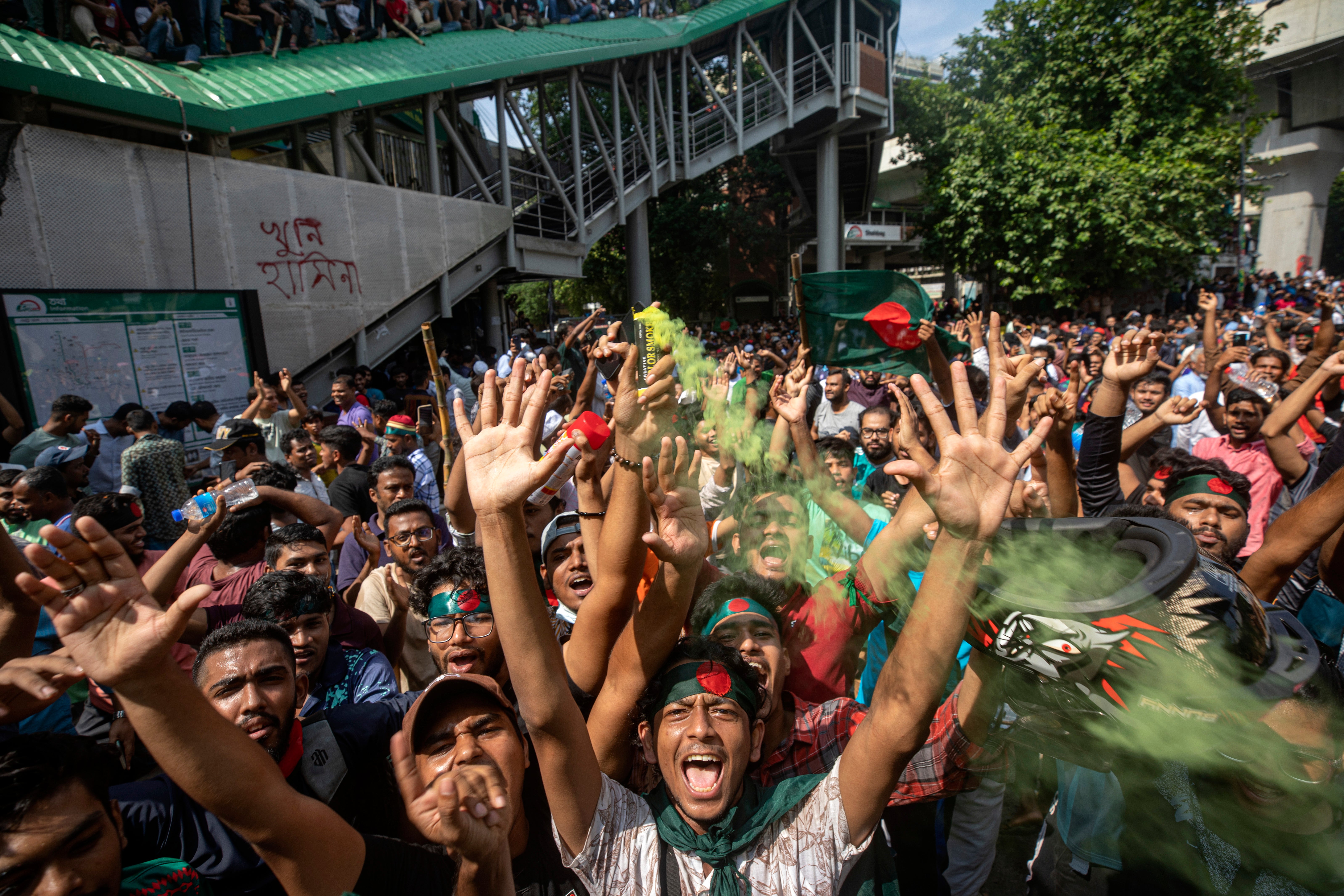 Protesters shout slogans as they celebrate