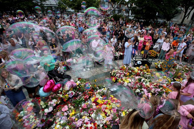 Members of the public take part in a vigil in Southport (Ryan Jenkinson/PA)