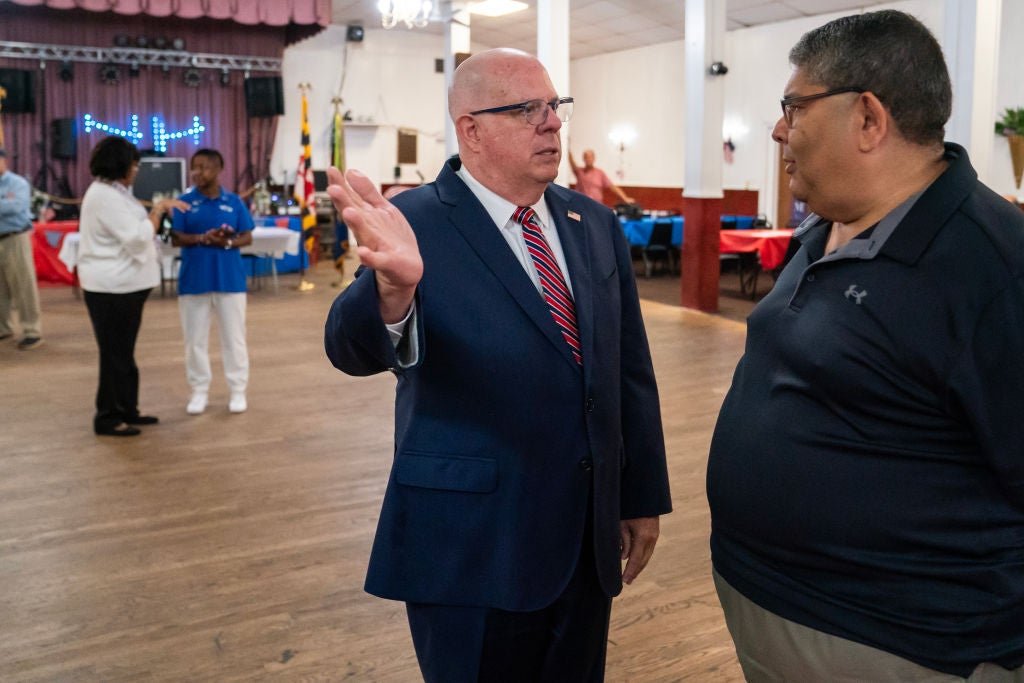 Former Maryland governor and and Republican Senate candidate Larry Hogan greets supporters during a campaign event at a VFW Post