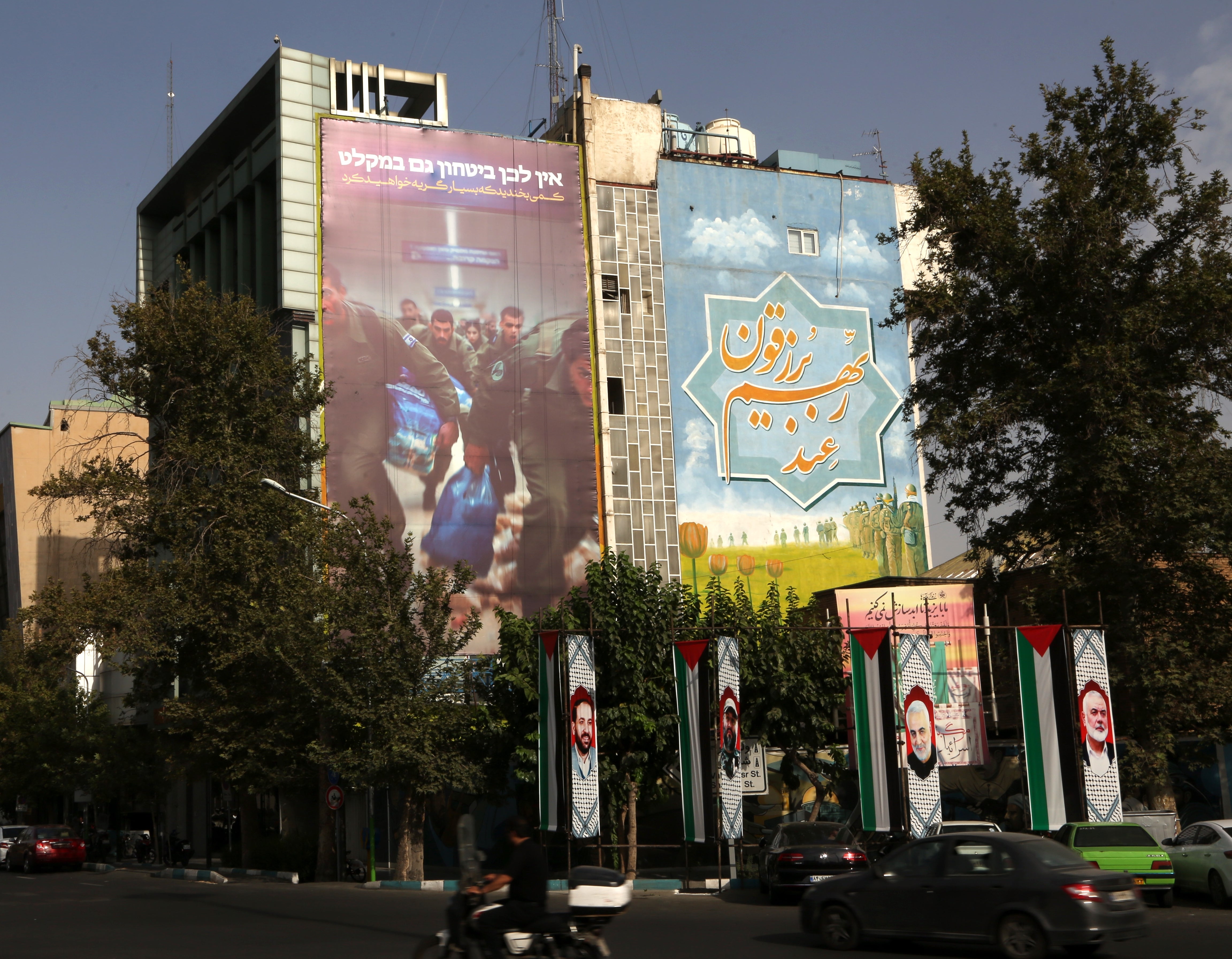 A giant anti-Israel banner hung up on a building facade at Palestine Square in Tehran