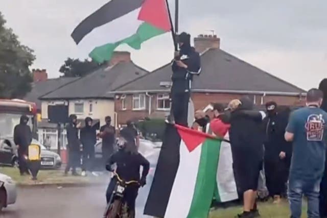 <p>Violence broke out in Birmingham overnight as masked men holding Palestinian flags were seen</p>
