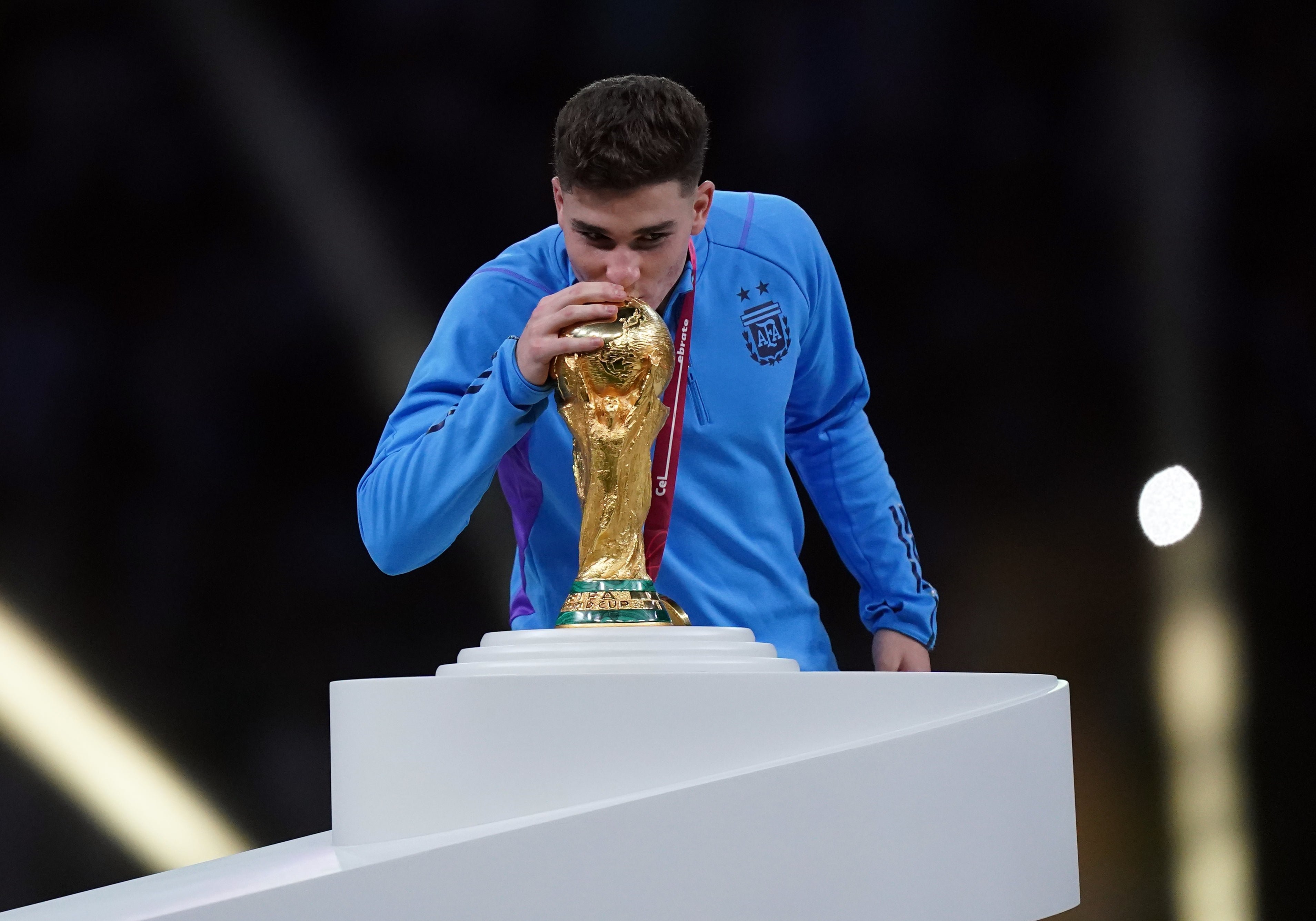 Julian Alvarez kisses the World Cup after Argentina beat France to win it in Qatar in 2022 (Mike Egerton/PA)