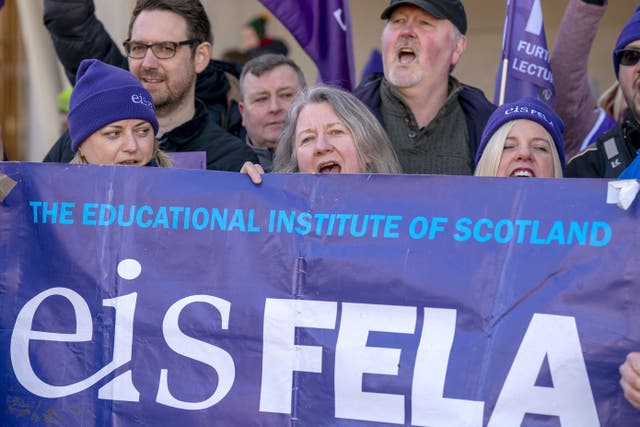 College lecturers from across Scotland gather at previous a rally outside the Scottish Parliament in Edinburgh. (Jane Barlow/PA)