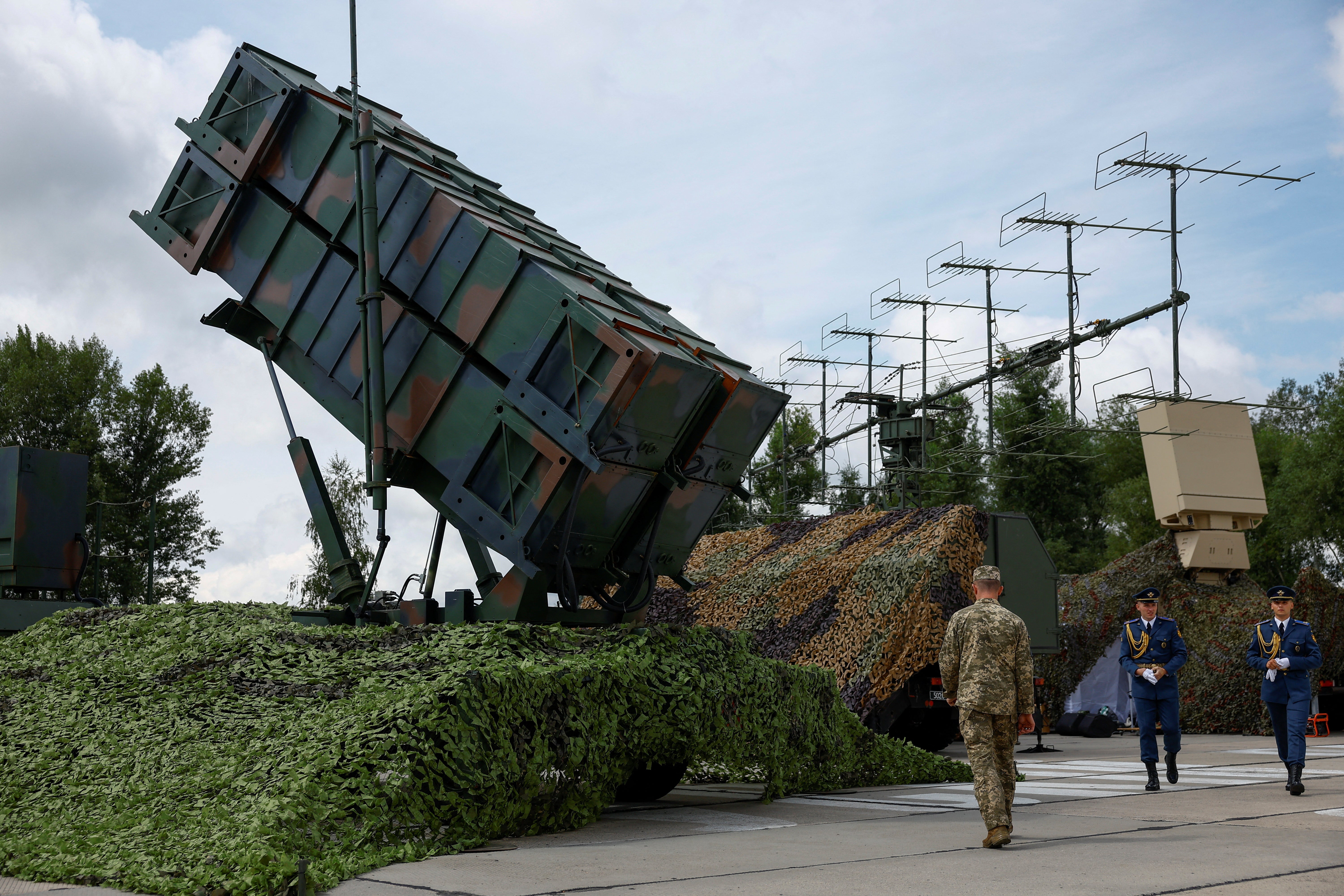 Ukrainian troops stand by the launcher of the Patriot air defense system, as it ‘shoots down ballistic and cruise missiles’ in overnight Russian attacks (REUTERS/Valentyn Ogirenko)