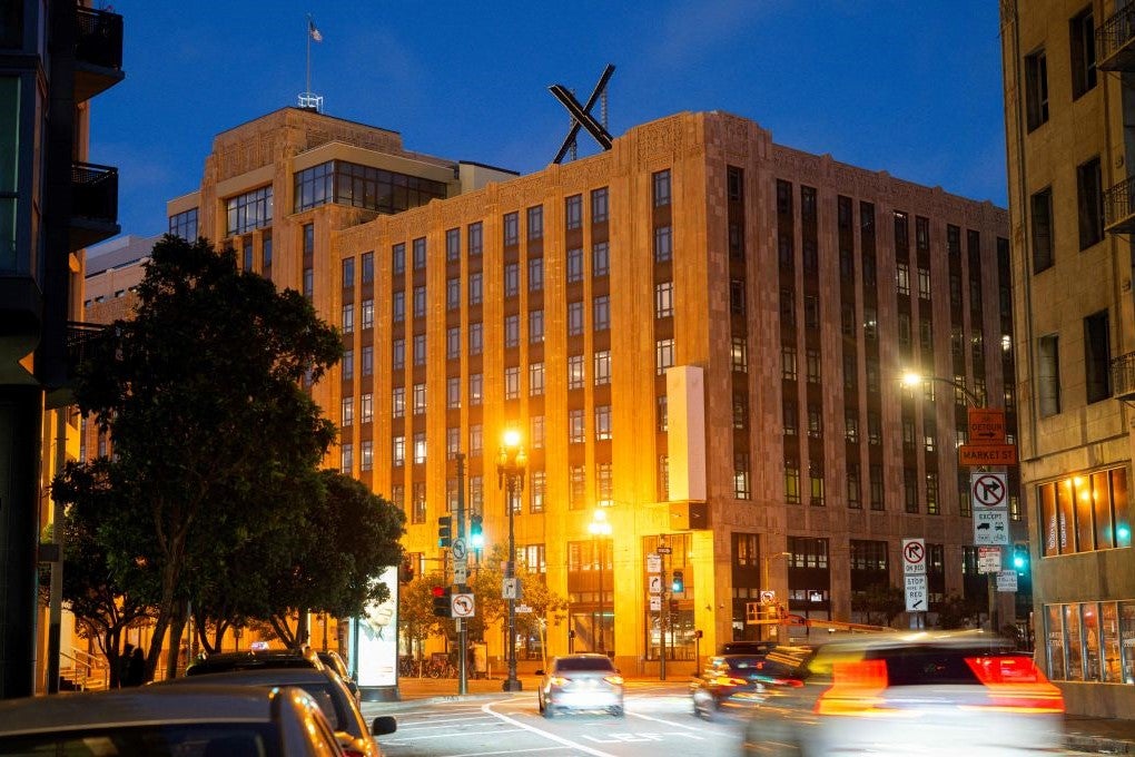 The X sign is seen on the roof of the headquarters of the social media platform previously known as Twitter, in San Francisco, on 29 July, 2023