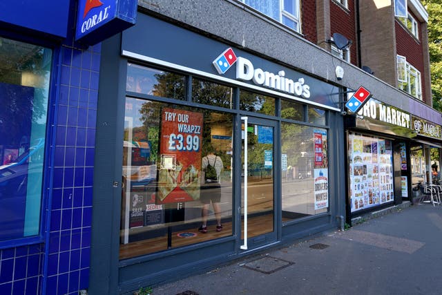 <p>Domino’s has said it will pass lower costs on to customers through better discount deals (Gareth Fuller/PA)</p>