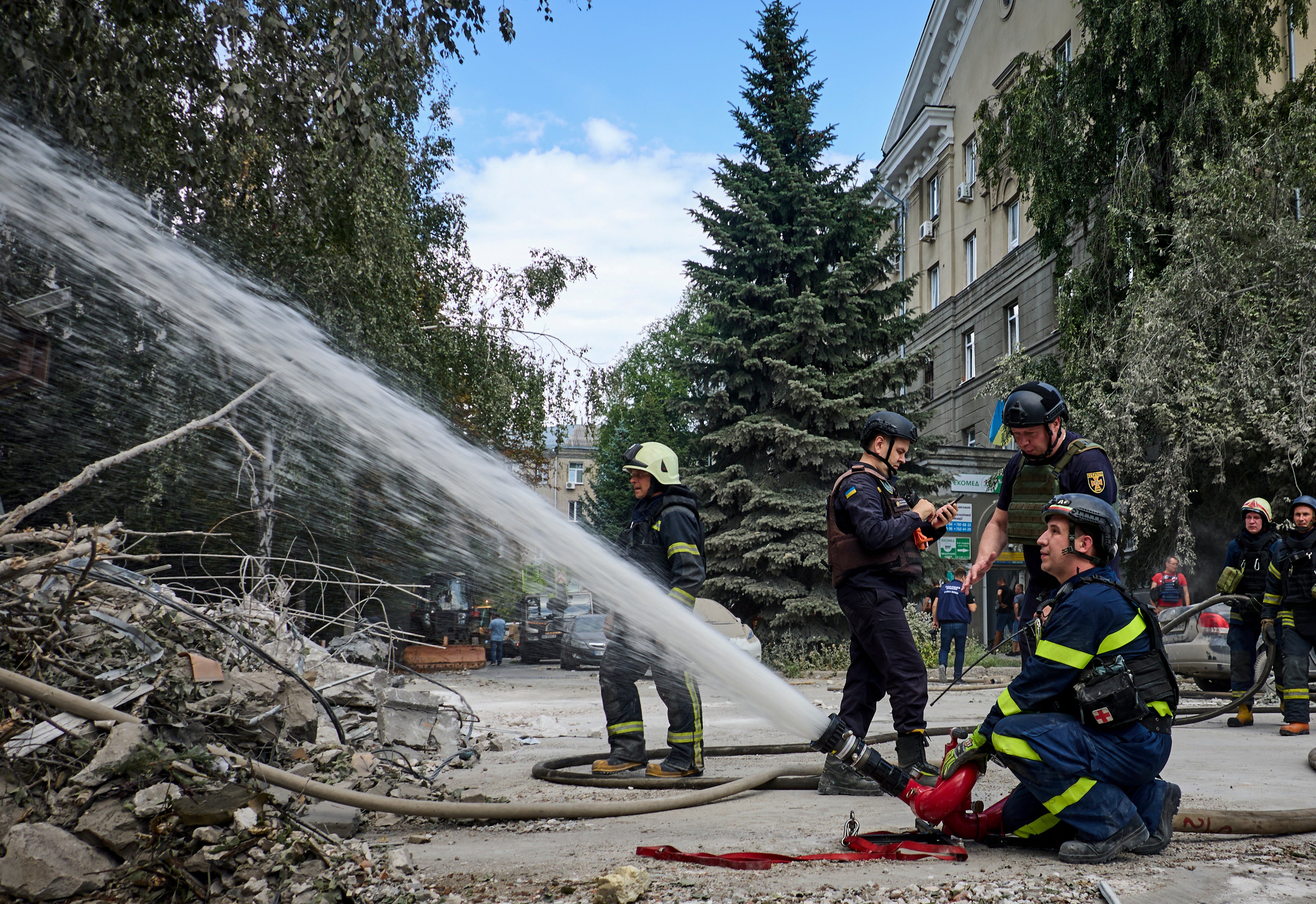 Emergency services put out fires due to the strikes which injured at least six