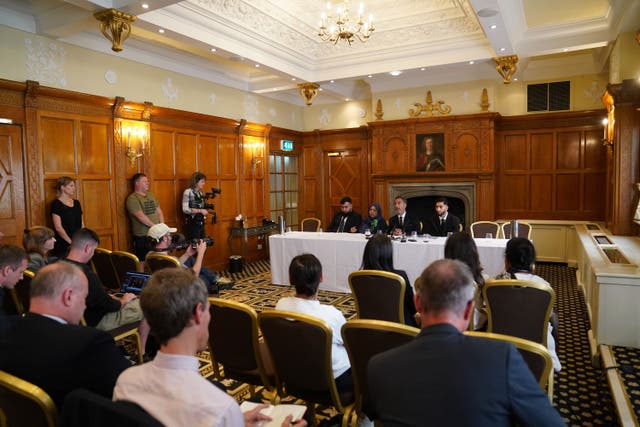 Brothers Muhammad Amaad and Fahir Amaaz and their mother Shameem Akhtar with their lawyer speak to the press about the attack (Owen Humphreys/PA)