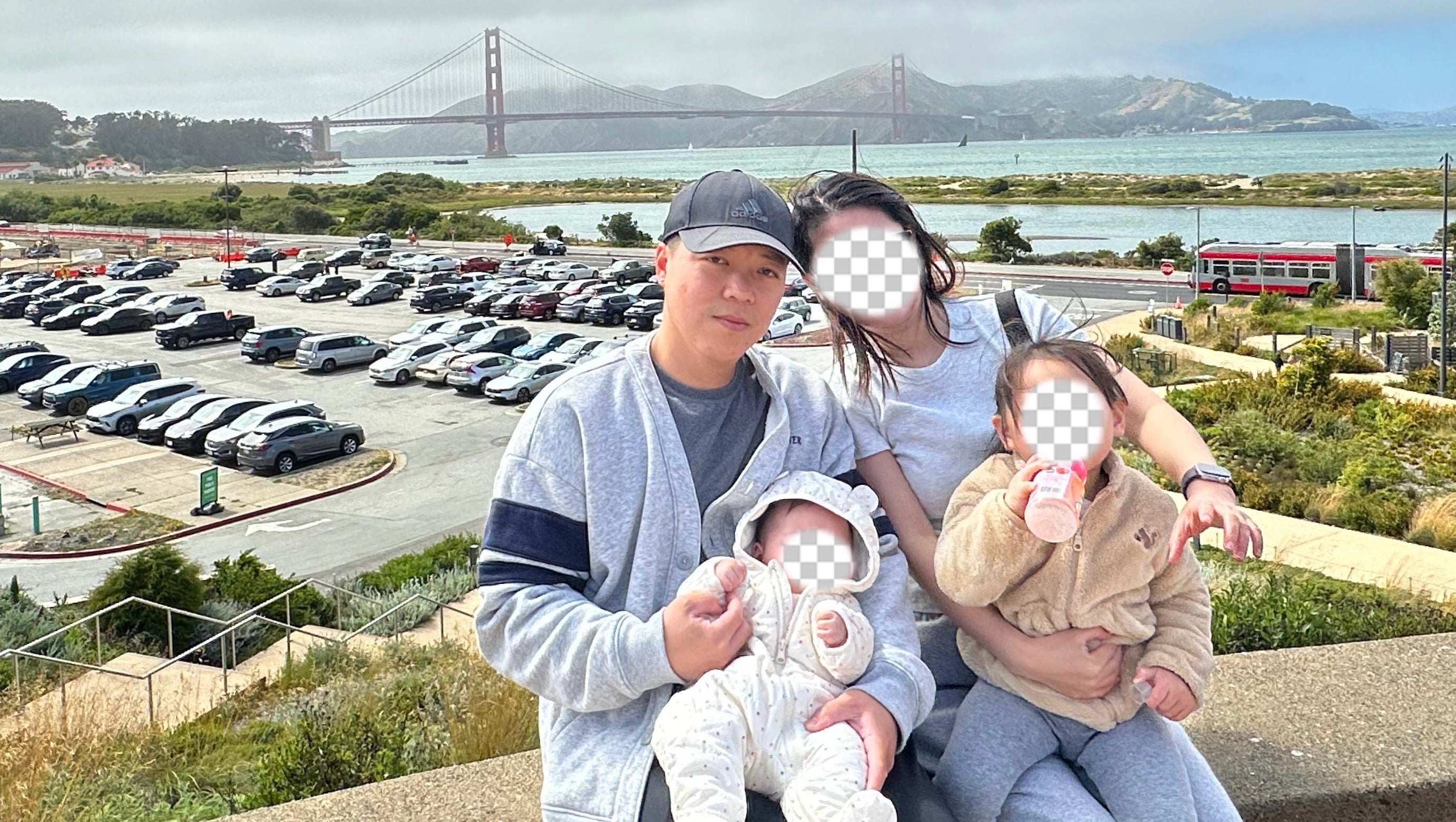 Run Hua Kuang, 33, with his wife and two children