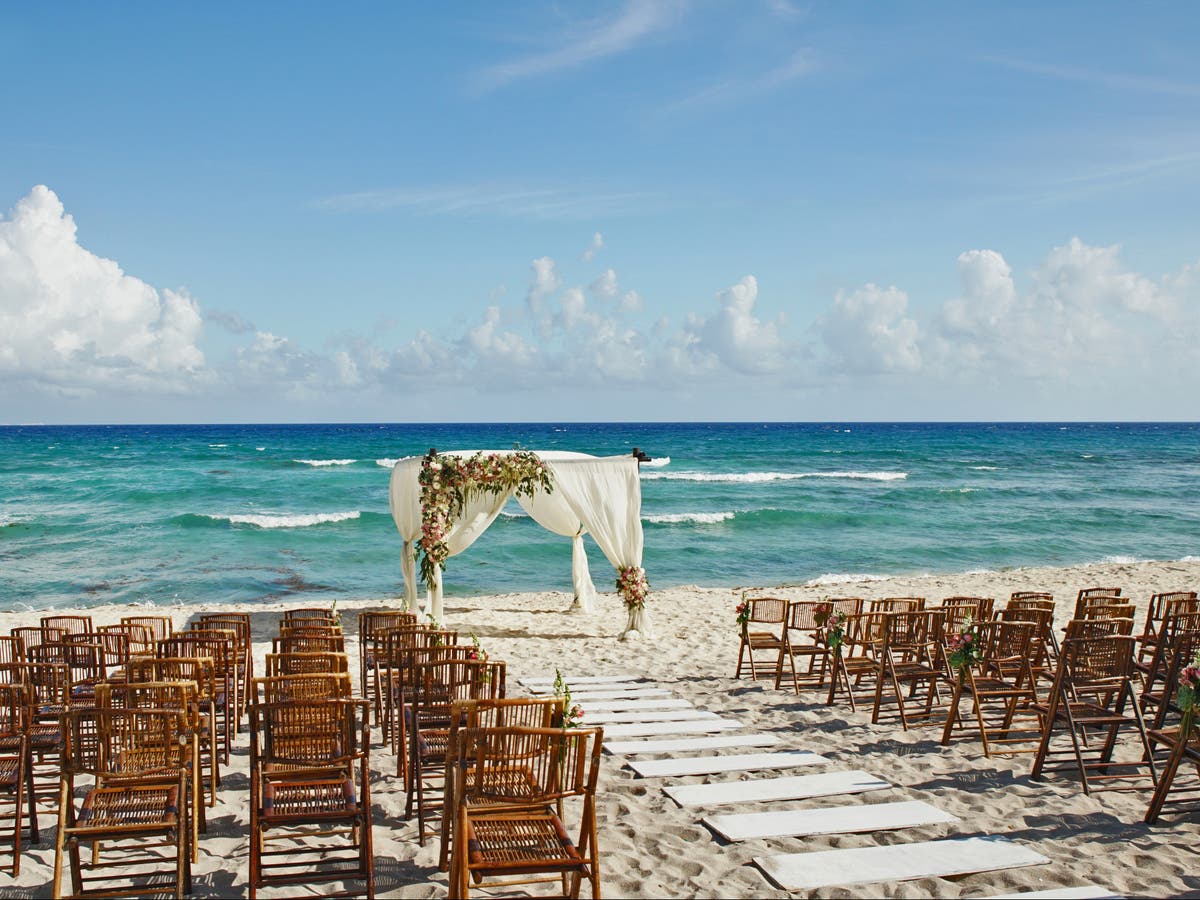 Woman angered after she books flights and hotel for destination wedding only to find out she&rsquo;s uninvited