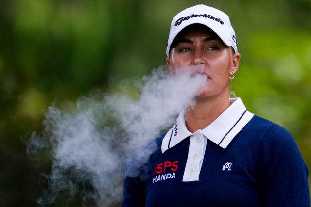 Charley Hull, pictured smoking during the Women’s PGA Championship, is facing a smoking ban in the Olympic tournament at Le Golf National (Lindsey Wasson/AP).