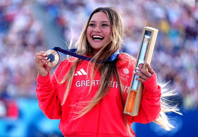 <p>Sky Brown celebrates with her bronze medal in Paris</p>