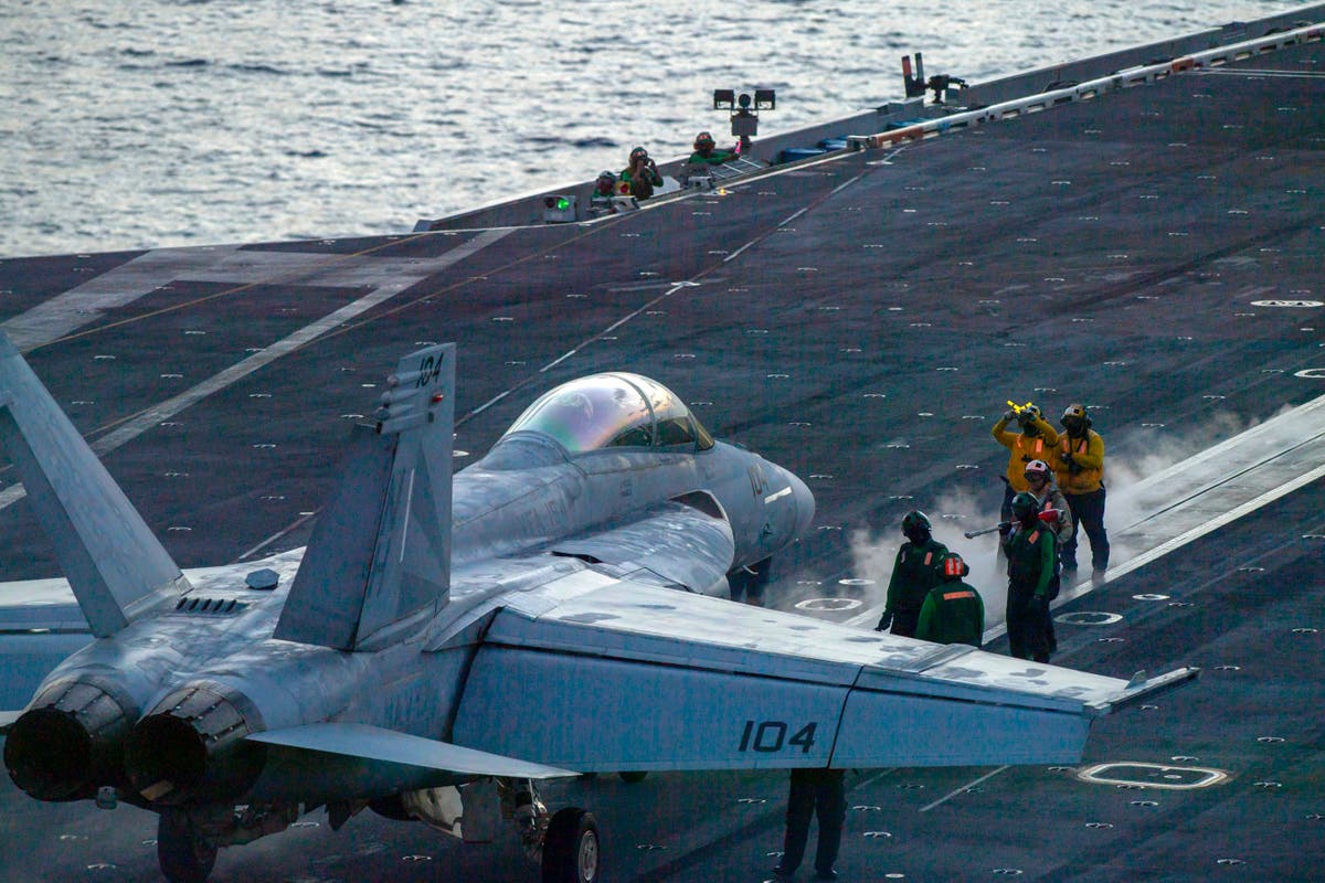 US sends ship-based Navy fighter jets to a base in the Middle East to help protect Israel