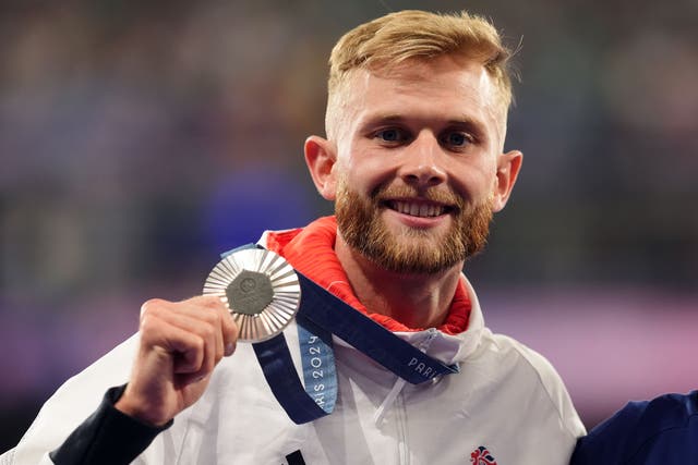 Great Britain’s Josh Kerr with his silver medal following the 1,500m final at the Paris Olympics (Martin Rickett/PA)