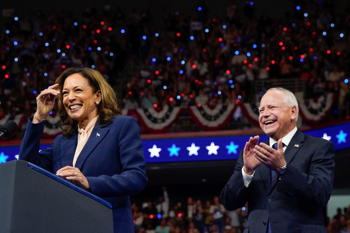 Kamala Harris and running mate Tim Walz take the stage at packed Philadelphia rally