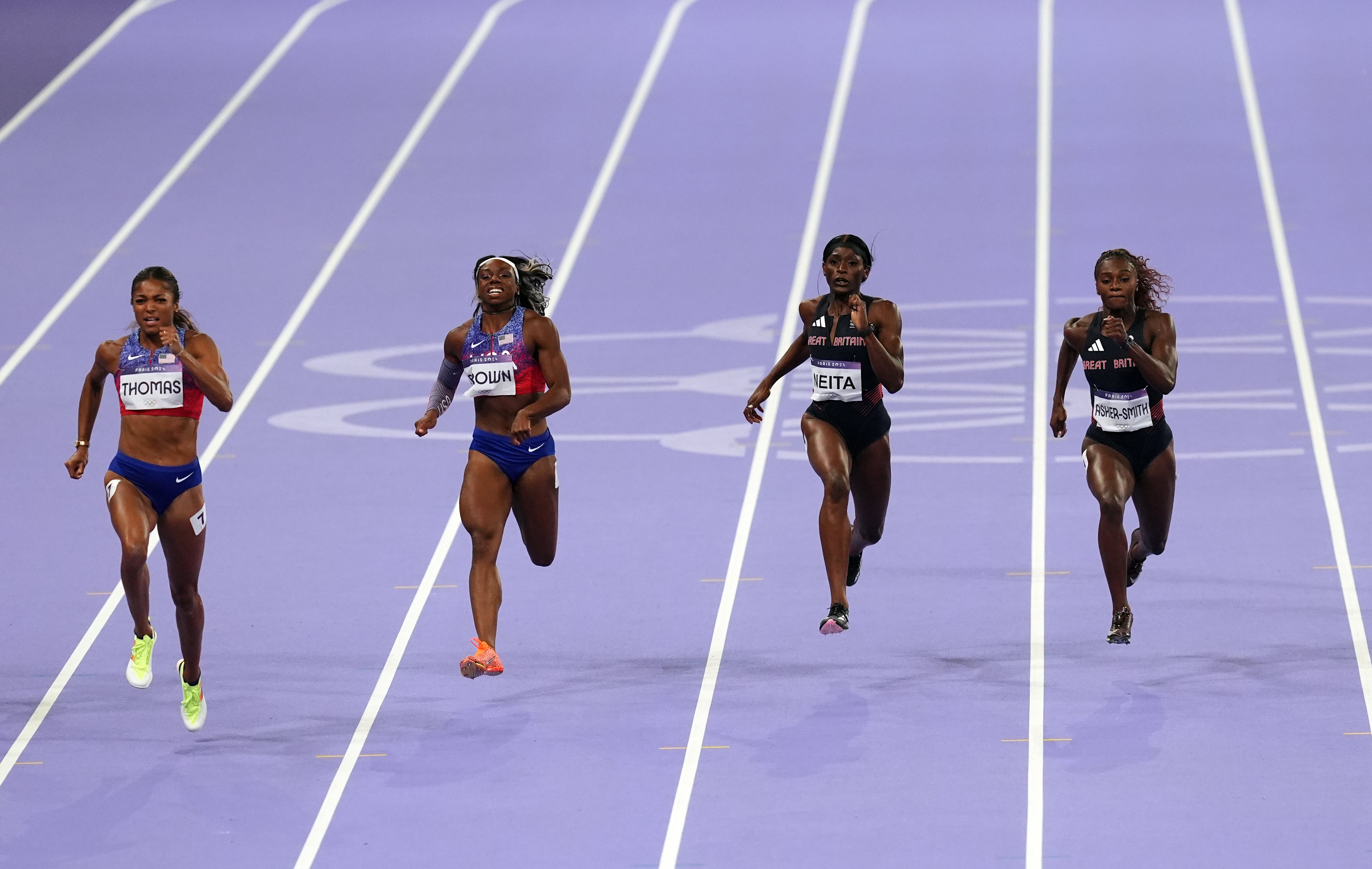 Great Britain’s Dina Asher-Smith, right, and Daryll Neita, second right, finish fourth and fifth in the women’s Olympic 200m final (Martin Rickett/PA)