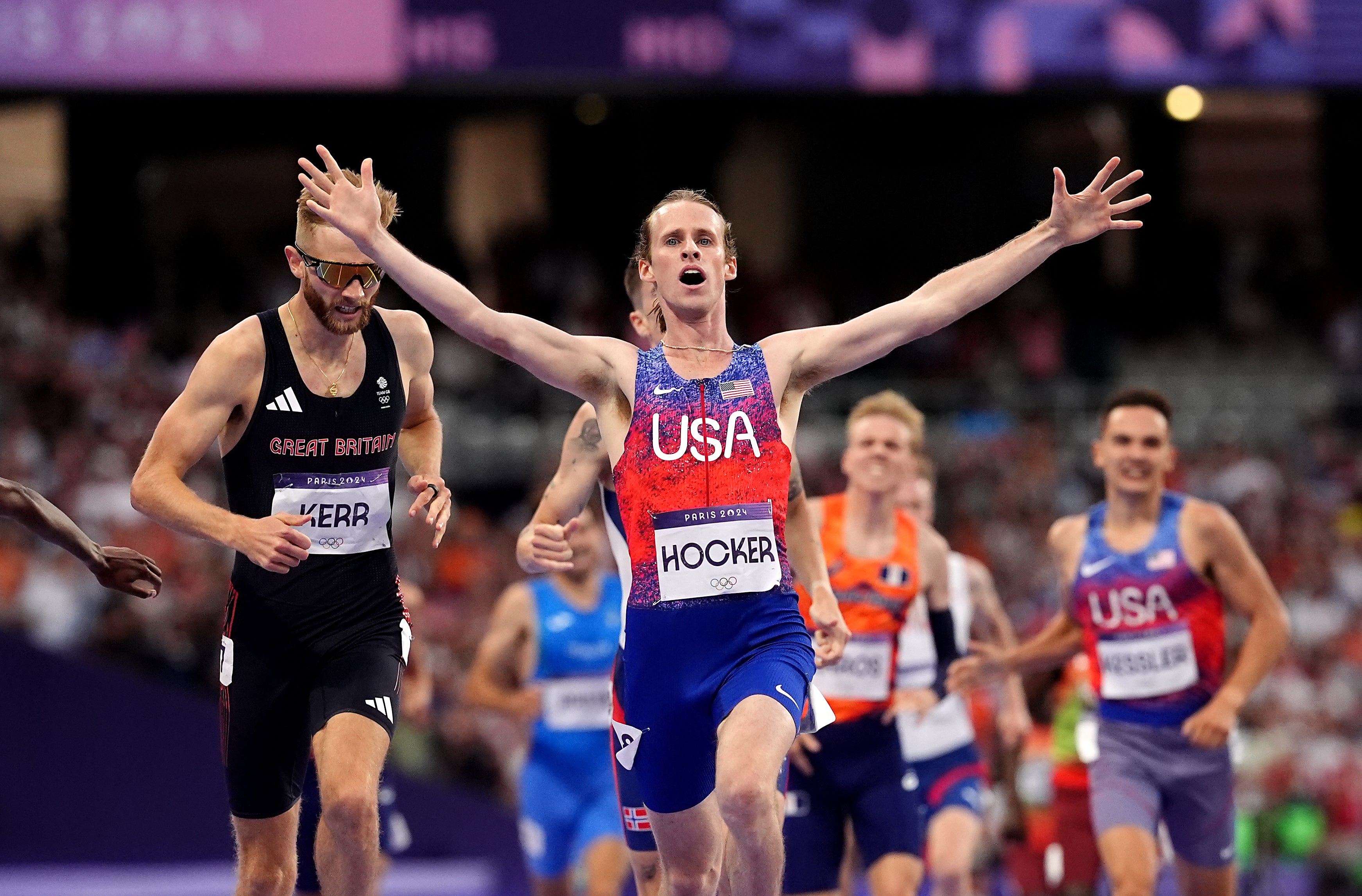 Josh Kerr, left, finishes second as American Cole Hocker celebrates winning the men’s 1500m (Martin Rickett/PA)