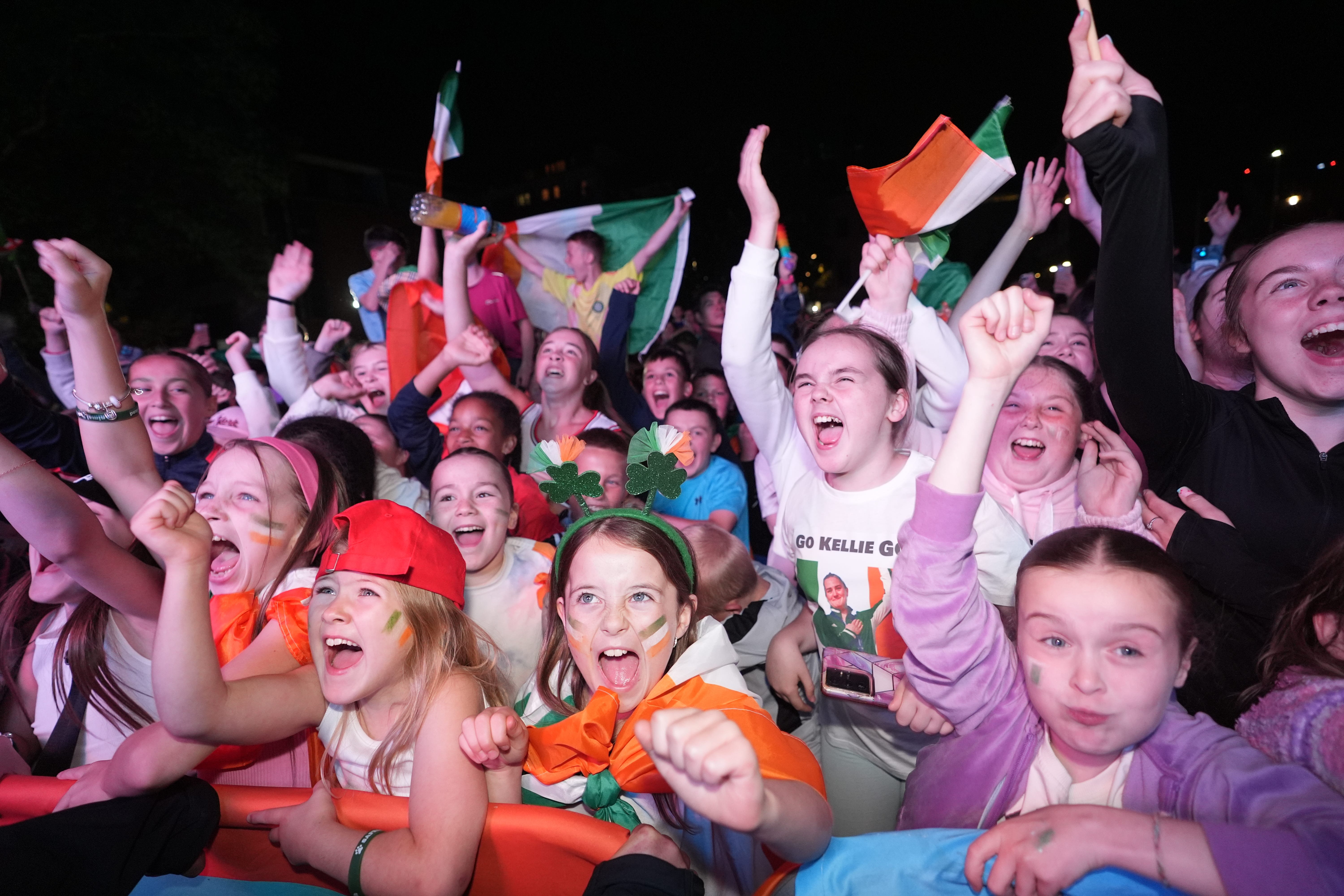 Fans celebrate as they watch Kellie Harrington’s boxing final (Niall Carson/PA)